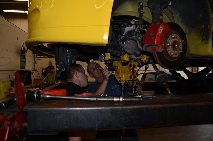 Roger Rogonia, 628th Force Support Squadron Auto Hobby Shop mechanic, assists a customer Jan. 11 at Joint Base Charleston-Air Base. Qualified mechanics are on staff to assist do-it-yourself customers with car care needs. (U.S. Air Force photo by/Senior Airman Anthony J. Hyatt)