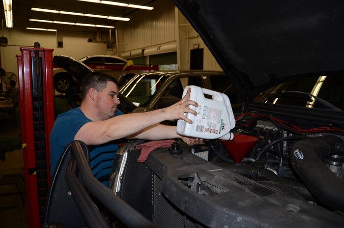 Staff Sgt. Edwin Lamboy, a Reservist from the 315th Maintenance Squadron, performs an oil change on his vehicle Jan. 11 at Joint Base Charleston-Air Base Auto Hobby Shop. The Auto Hobby Shop provides customer-driven instructional programs to enhance individual life skills that are offered in a safe, well-equipped environment using expert instructors. (U.S. Air Force photo by/Senior Airman Anthony J. Hyatt)