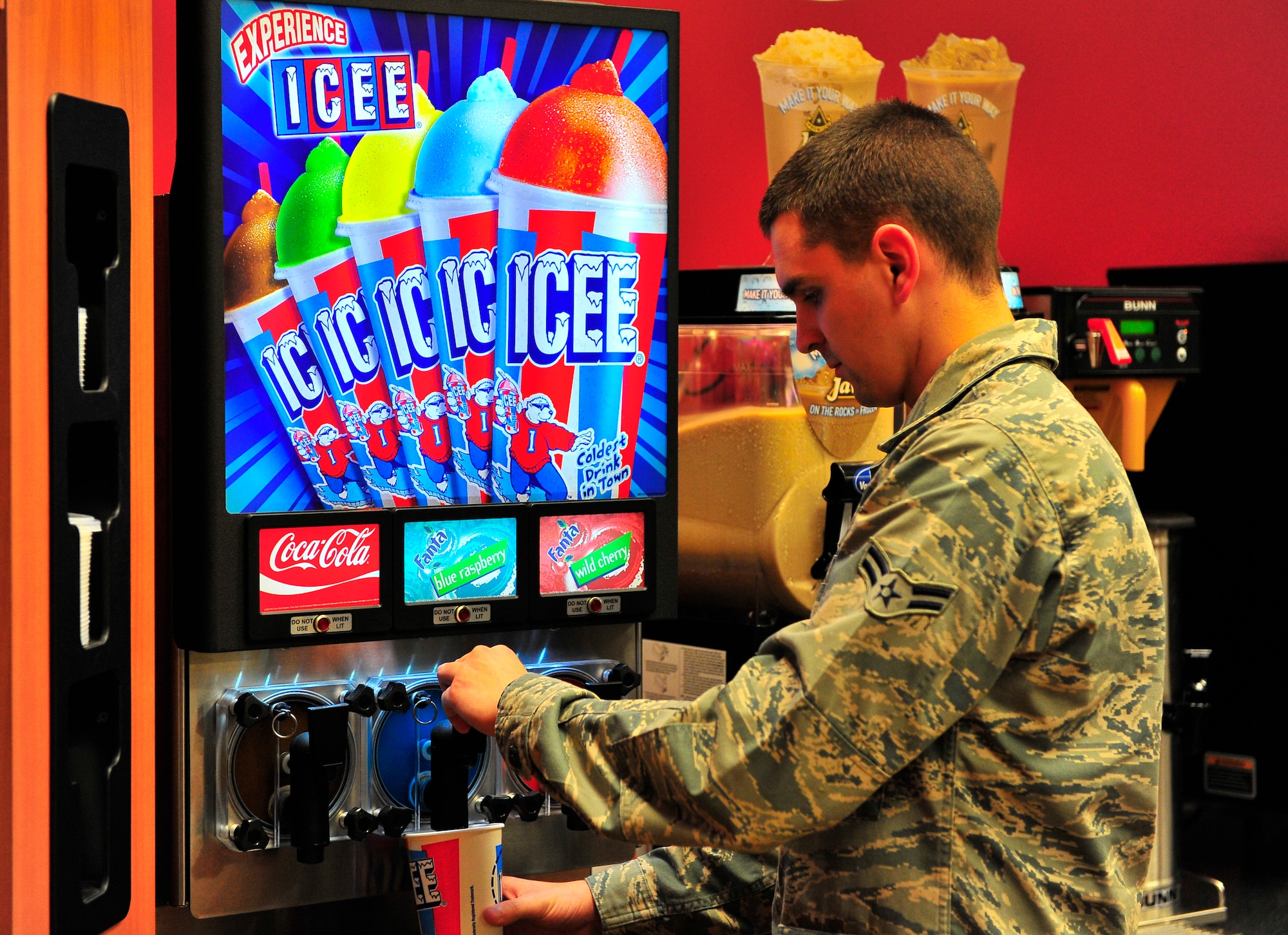 U.S. Air Force Airman 1st Class Josh Wagner, 20th Comptroller Squadron permanent change of station technician, uses the Icee machine at the recently renovated shoppette at Shaw Air Force Base, S.C. Jan. 17, 2011. Approximately $400,000 of renovations were completed to accomodate the growing population of Shaw, resulting in faster service and a greater capacity for goods.  (U.S. Air Force photo/Senior Airman Neil D. Warner/Released)