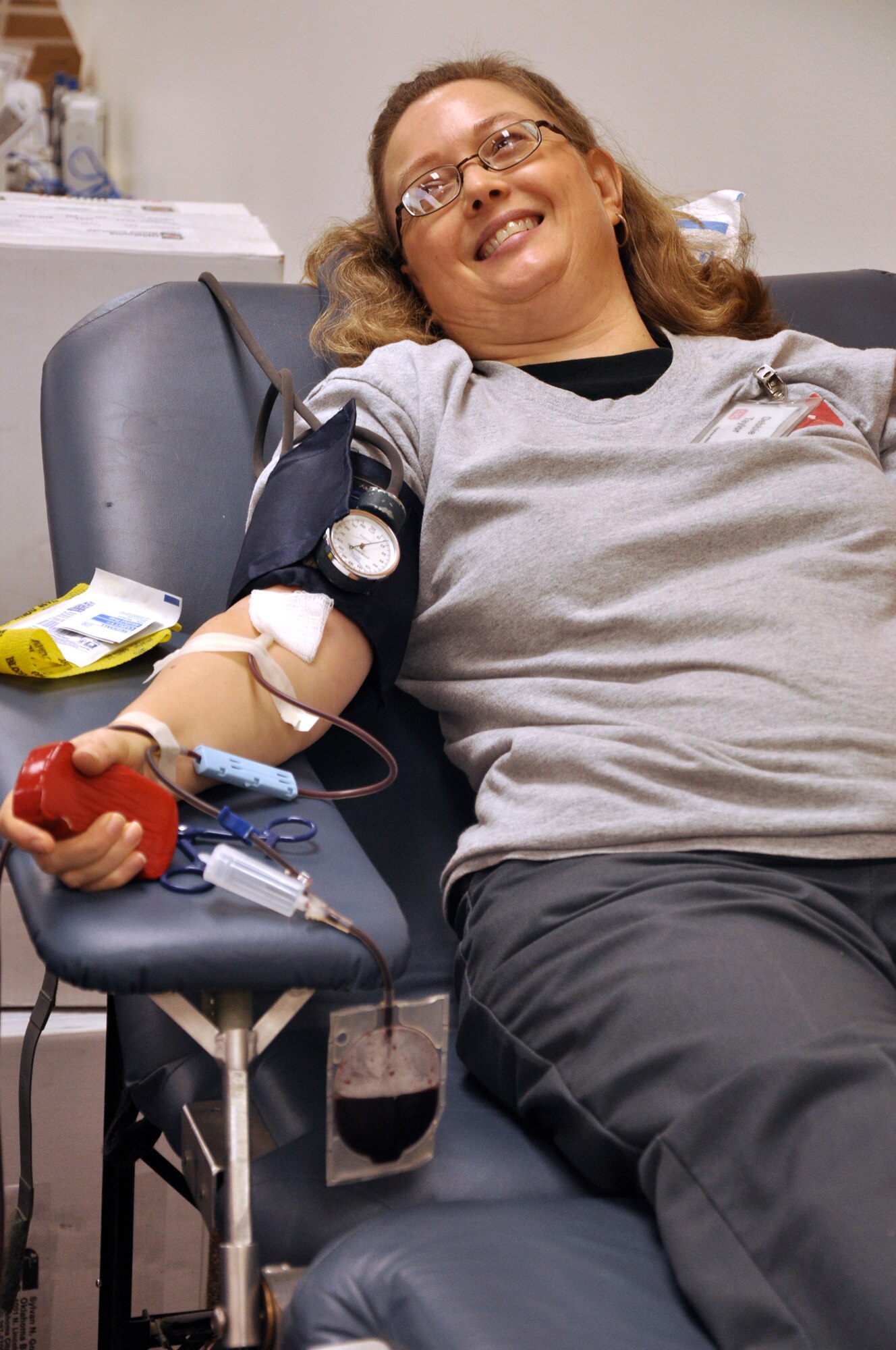 Debbie Taylor, a CSC Applied Technologies hangar custodian in the T-38 maintenance unit at Vance Air Force Base, Okla., is one of 104 Team Vance donors at the Oklahoma Blood Institute drive held Jan. 13 at the Community Chapel Activity Center. Team Vance’s generosity will impact 312 patients’ lives, said Jessy Dershem with OBI. (U.S. Air Force photo/ Airman 1st Class Frank John Casciotta)