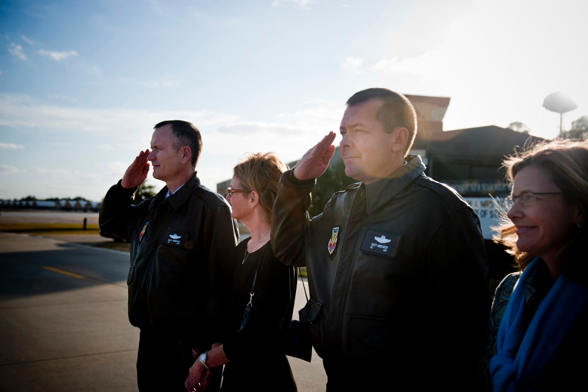 U.S. Air Force Col. Billy Thompson, 23d Wing commander (far left), his wife Julie Thompson, and Col. Scott Kindsvater, 93d Air Ground Operations Wing commander (second from right), his wife Lisa Kindsvater stand by as Air Force Chief of Staff Gen. Norton Schwartz’s aircraft comes to a halt at Moody Air Force Base, Ga., Jan. 17, 2012. During his visit, Schwartz met with Airmen from both the 23d Wing and 93d Air Ground Operations Wing. (U.S. Air Force photo by Staff Sgt. Jamal D. Sutter/Released) 