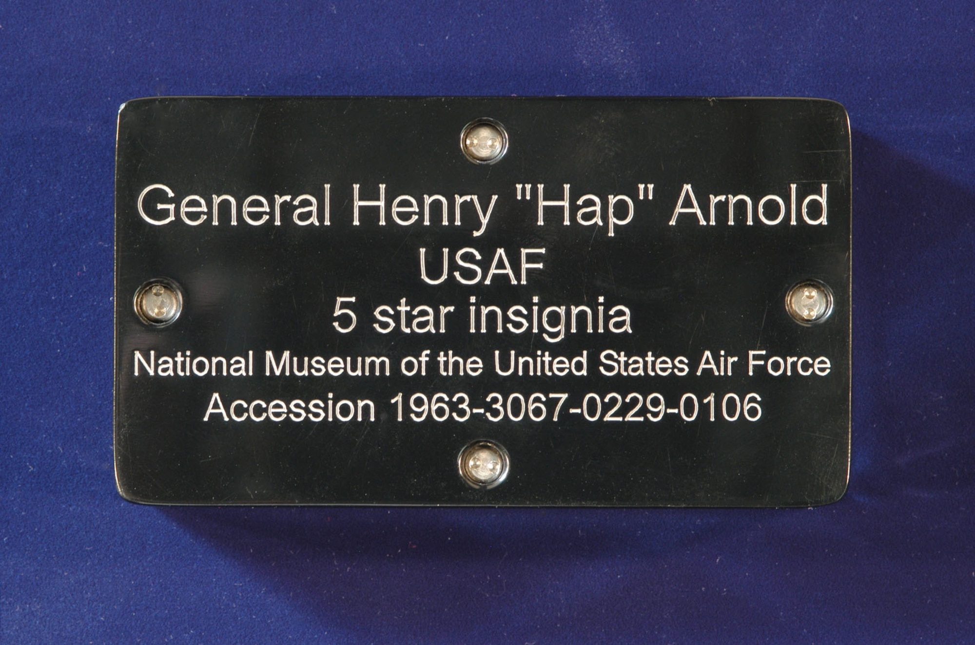 Inscription on the back of the Plexiglas container on display. Museum staff custom-built this container to keep Arnold’s insignia well-protected during Endeavour’s final flight. (U.S. Air Force photo)