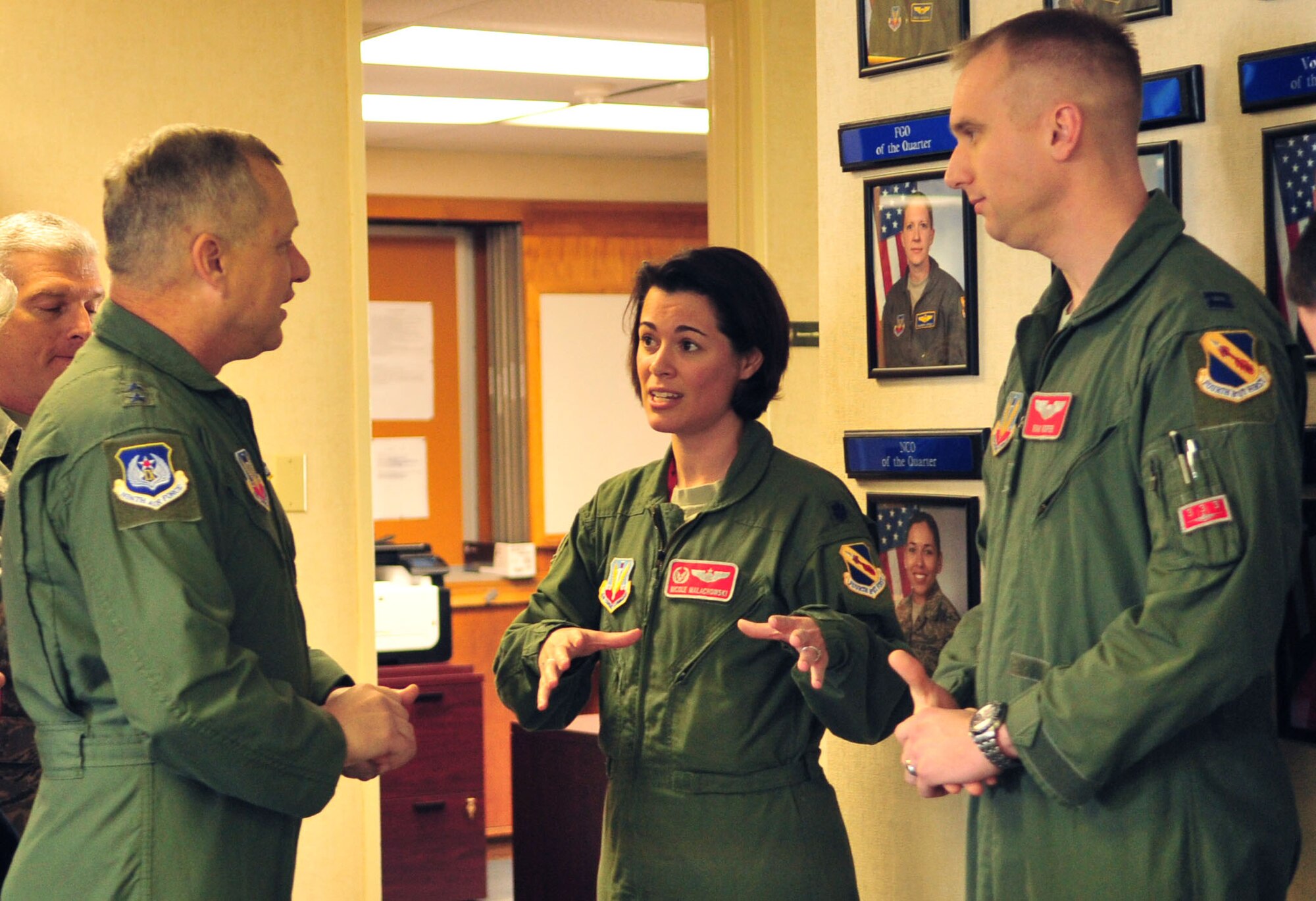 Maj. Gen Lawrence Wells, 9th Air Force commander, receives a mission brief from Lt. Col. Nicole Malachoski, 333rd Fighter Squadron commander and Capt. Ryan Roper, 333rd FS instructor pilot, on Seymour Johnson Air Force Base, N.C., Jan. 12, 2012. The general toured various work centers around the base for a first-hand view of how Airmen at the 4th Fighter Wing carry out the Air Combat Command mission. (U.S. Air Force photo/ Senior Airman Marissa Tucker) 