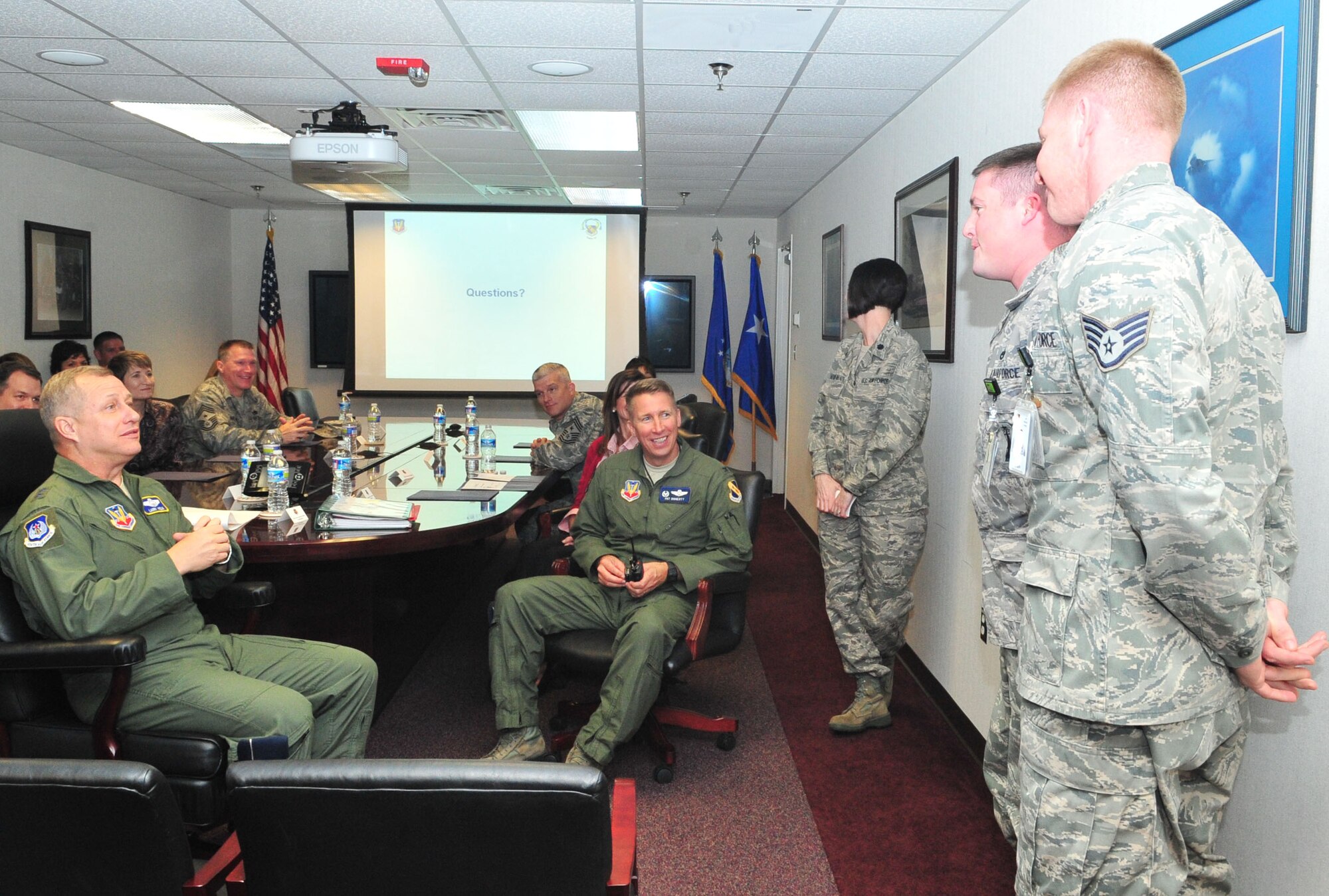 Maj. Gen. Lawrence Wells, 9th Air Force commander, and Col. Patrick Doherty, 4th Fighter Wing commander, congratulate Airmen on a job well done after a brief on the cost of health care at Seymour Johnson Air Force Base, N.C., Jan. 12, 2012. During his two-day visit, Wells’ held an all-call where he discussed the direction of the Air Force, including cutbacks and deployments. This was Wells first visit to Seymour Johnson since assuming command of the 9th Air Force in October 2011. (U.S. Air Force photo/ Senior Airman Marissa Tucker)