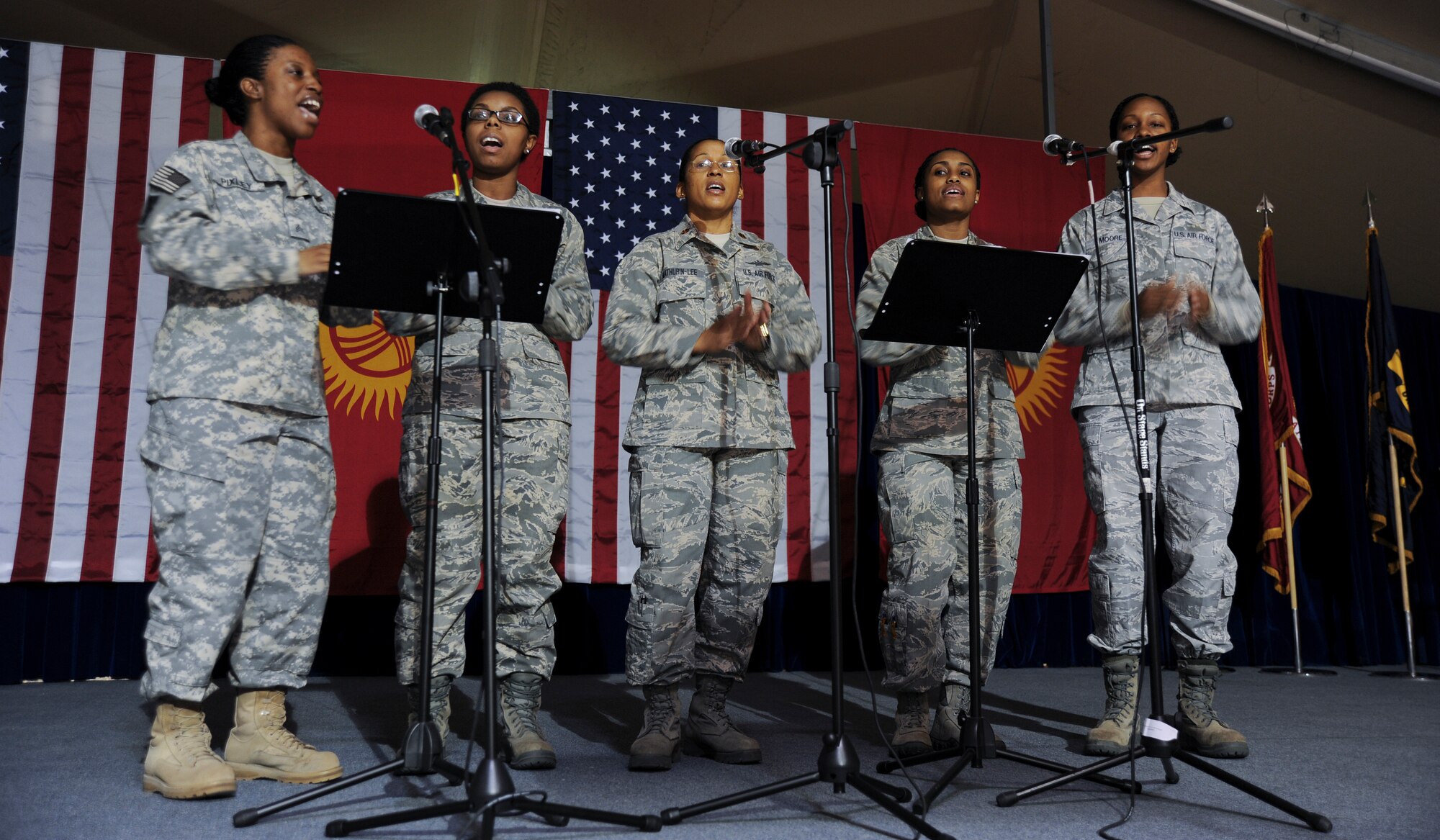 Members of the Transit Center at Manas gospel choir share acapella music during a Martin Luther King Jr. commemorative reception Jan. 16, 2012, Kyrgyzstan. The crowd clapped along as the Soldier and Airmen sang the hymn "This Little Light of Mine."
(U.S. Air Force photo/Master Sgt. Tracy L. DeMarco)
