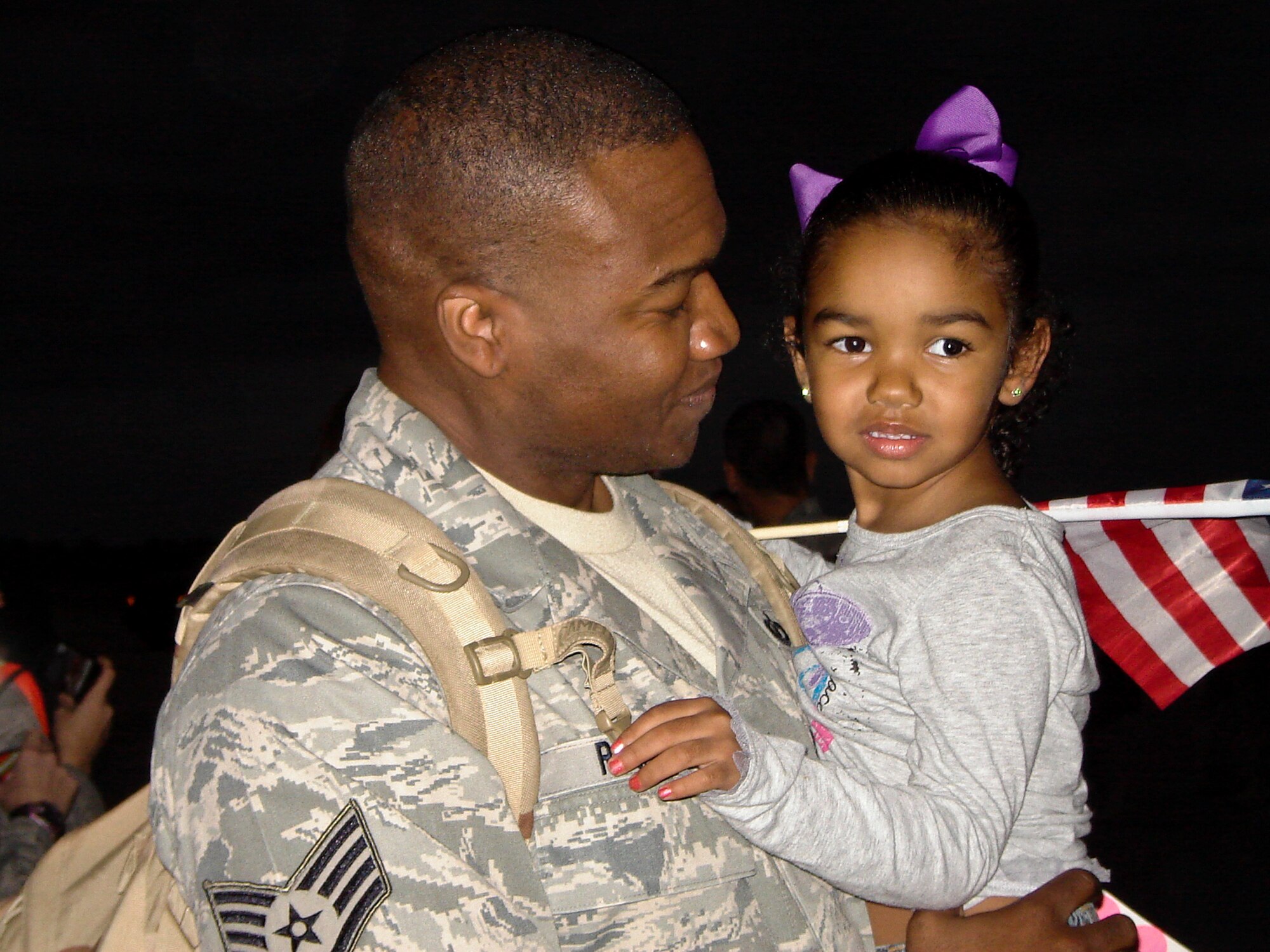 Staff Sgt. Mario Rogers, a 1C5/weapons director, Tyndall AFB, returns home Jan. 17 after augmenting the 728th Air Control Squadron on their deployment. Friends and family welcomed home more than 200 members of the 728th Air Control Squadron Jan. 17.  The Airmen, who arrived from Southwest Asia,  provide command and control of joint air operations by conducting surveillance, identification, weapons control, battle management and theater communications data link.  (U.S. Air Force photo/Lois Walsh)