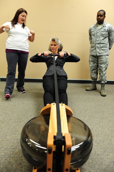 Sharon Grieve, manager of BellaMorphosis, shows Kathy Wells how to row an Indorow on Seymour Johnson Air Force Base, N.C., Jan. 13, 2012. The Indorow is similar to a rowing machine but uses water for tension and causes less impact on the joints. BellaMorphosis is the only women’s only fitness center in the Air Force and is the first Air Force gym to have these machines. Wells is visiting Seymour Johnson AFB with her husband, Maj. Gen. Lawrence Wells, the 9th Air Force commander.  (U.S. Air Force photo/Airman 1st Class Mariah Tolbert)
