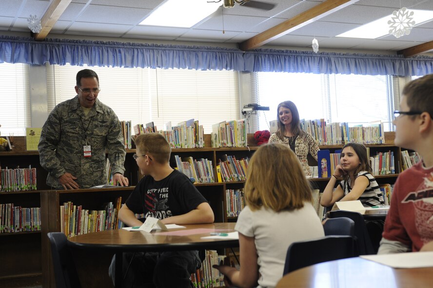 MINOT AIR FORCE BASE, N.D. -- Chief Master Sgt. Kevin Jurgella, 5th Bomb Wing command chief, moderates the 2012 Dakota Elementary Geography Bee Jan. 12. The children were faced with challenging questions about geographical locations in the U.S. and around the world. (U.S. Air Force Photo/Airman 1st Class Stephanie Ashley)