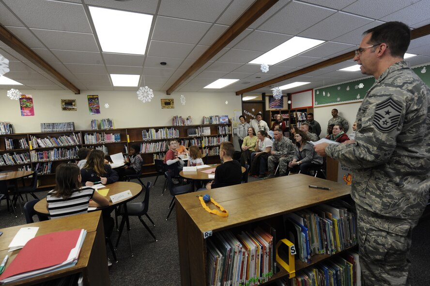 MINOT AIR FORCE BASE, N.D. -- Chief Master Sgt. Kevin Jurgella, 5th Bomb Wing command chief, moderates the 2012 Dakota Elementary Geography Bee Jan. 12. The children were faced with challenging questions about geographical locations in the U.S. and around the world. (U.S. Air Force Photo/Airman 1st Class Stephanie Ashley)