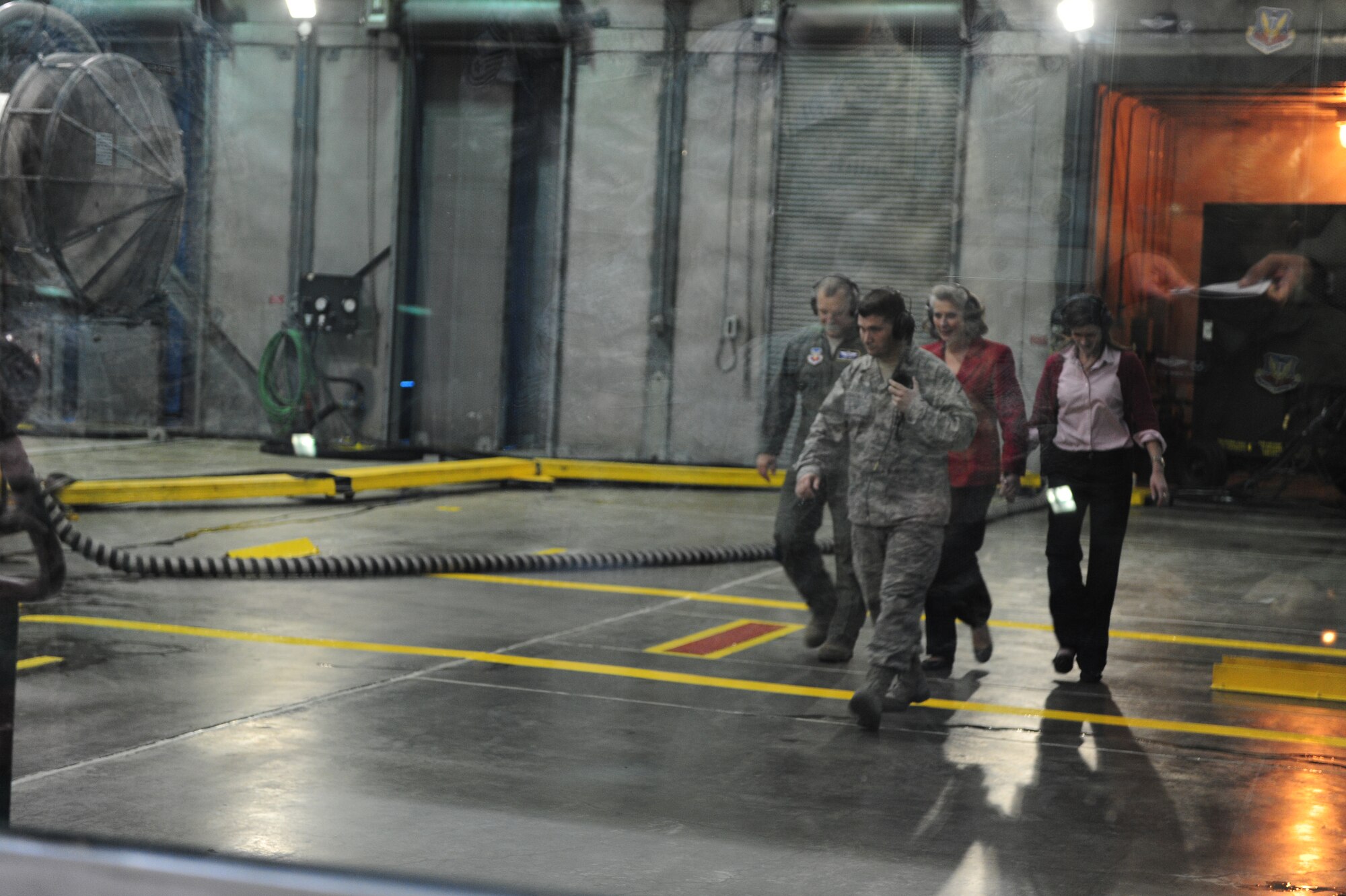 Maj. Gen. Lawrence and Kathy Wells, along with Dee Dee Doherty, wife of Col. Patrick Doherty, 4th Fighter Wing commander, depart the 4th Component Maintenance Squadron Hush House with Master Sgt. Steven Bobadilla, 4th CMS test cell section chief, on Seymour Johnson Air Force Base, N.C., Jan. 12, 2012., shows At the Hush House Airmen assess and repair broken F-15E Strike Eagle engines. The Wells visited here to learn the needs of 4th Fighter Wing Airmen and to thank them for their performance during the past year. This was their first visit since Wells assumed command of the 9th Air Force in October 2011.(U.S. Air Force photo/Airman 1st Class Mariah Tolbert) 
