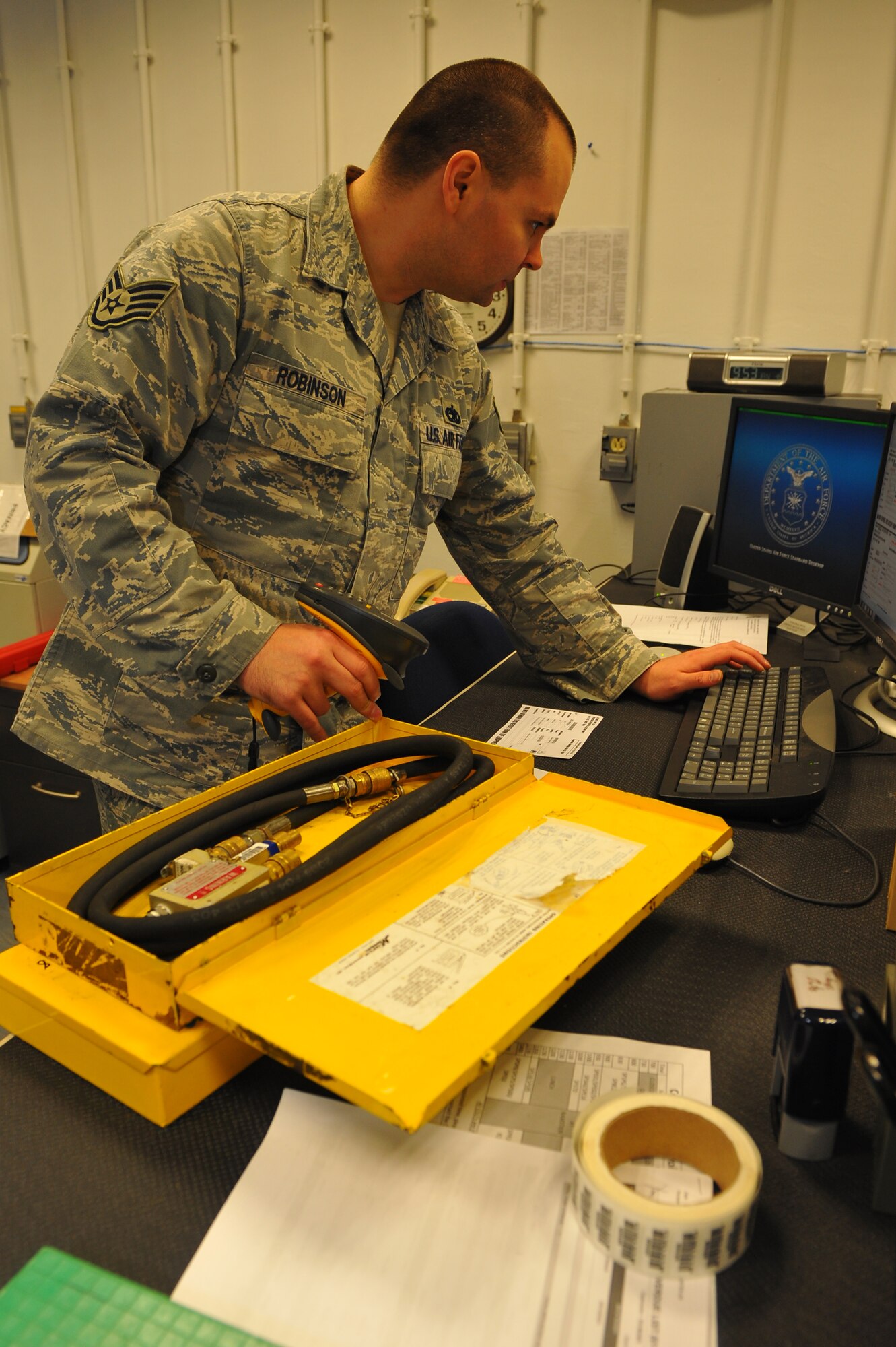 SPANGDAHLEM AIR BASE, Germany – Staff Sgt. Joseph Robinson, 52nd Component Maintenance Squadron electronic warfare craftsman, inputs equipment catalog information into a computer system inside the precision measurement equipment laboratory centralized collection point (PMEL CCP) here Jan. 18 before the equipment is sent out for calibration. PMEL CCP saves the Air Force money by gathering equipment from 77 separate unit accounts and delivering them to the precision measurement equipment laboratory at Ramstein Air Base in one truckload rather than 77 separate trips. The PMEL CCP delivers unit equipment ranging from a torque wrench to radio frequency signal generators used to calibrate aircraft avionics systems. (U.S. Air Force photo/Airman 1st Class Dillon Davis)
