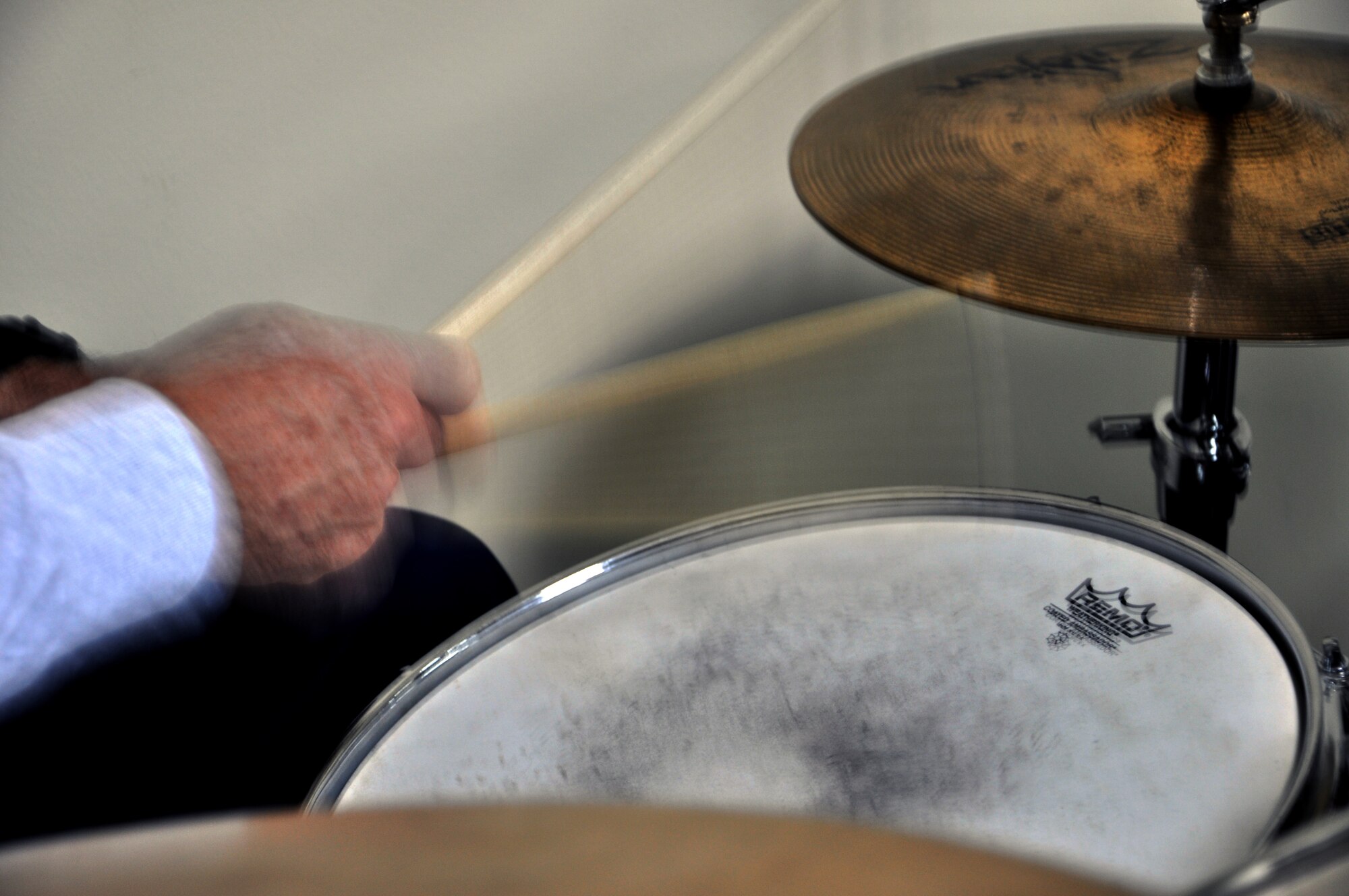 Senior Master Sgt. Mark Lounello, 332nd Air Expeditionary Wing chaplain assistant, plays the drums during a Martin Luther King Jr. Day celebration at the base chapel Jan. 16, 2012 at an undisclosed location in Southwest Asia. Lounello is deployed from the Virginia Air National Guard. (photo by Senior Airman Melanie Holochwost)