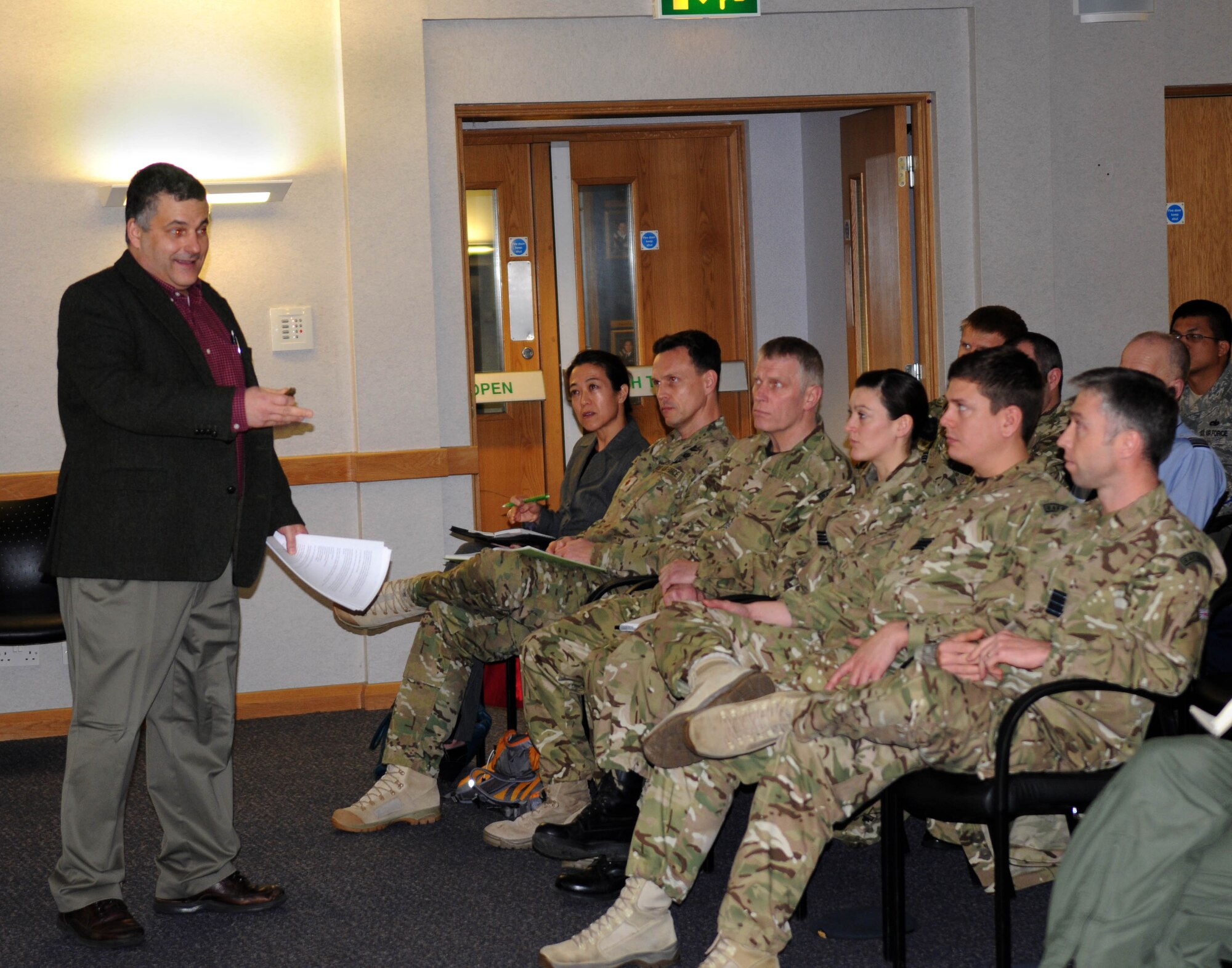 RAF MILDENHALL, England-- Tarak Barkawi, Ph.D., New School for Social Research, department of politics, explains the underestimation of an opponent of a past war to the audience during his lecture “Small Wars, Big Consequences,” given here, Jan. 6, 2012. Members from RAF Honington were in attendance, along with Team Mildenhall Airmen. (U.S. Air Force photo/Senior Airman Rachel Waller) 
