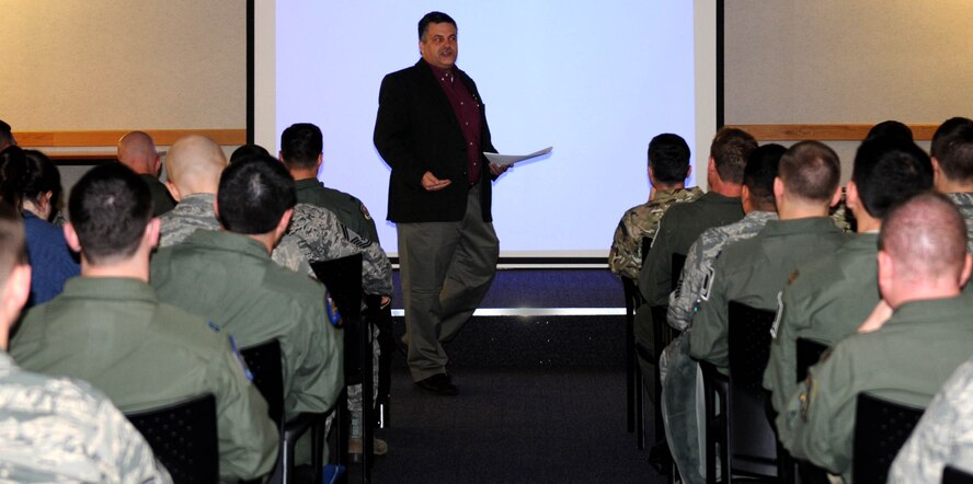 RAF MILDENHALL, England-- More than 60 members Team Mildenhall and several members from RAF Honington, listen to Tarak Barkawi, Ph.D., New School for Social Research, department of politics, lecture Jan. 6, 2012, at the 100th Operations Group auditorium. During his lecture titled “Small Wars, Big Consequences,” Barkawi discussed overestimating a country’s power and underestimating the opposition. (U.S. Air Force photo/Senior Airman Rachel Waller) 