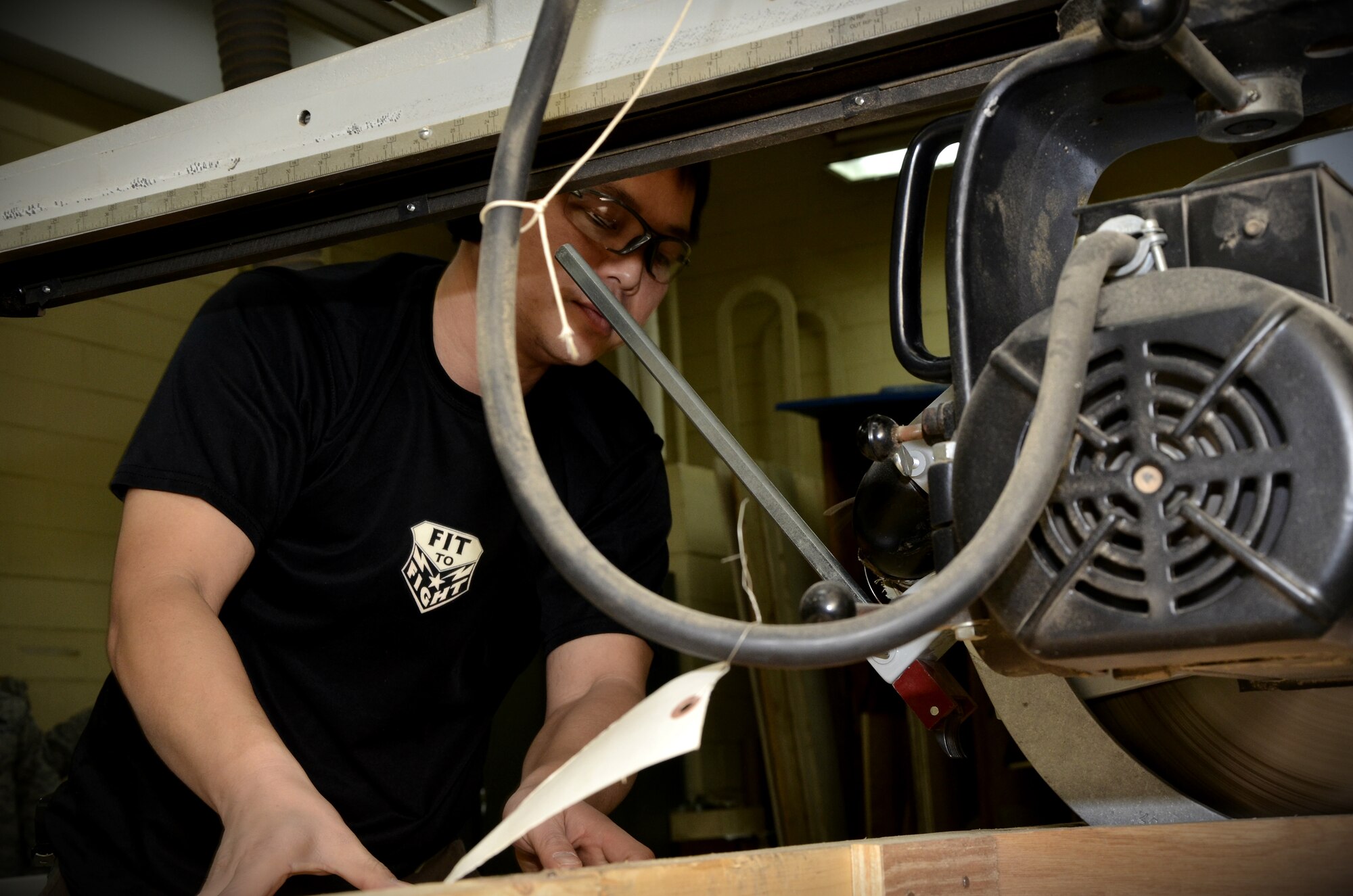 Kwangmin Ko, 8th Logistics Readiness Squadron wood working specialist, prepares a piece of wood for a cargo crate at Kunsan Air Base, Republic of Korea, Jan. 10, 2012. The traffic management flight has three distinct sections that routinely perform above and beyond, putting bread and bullets in the hands of the Wolf Pack. (U.S. Air Force photo by Senior Airman Benjamin Stratton/Released)