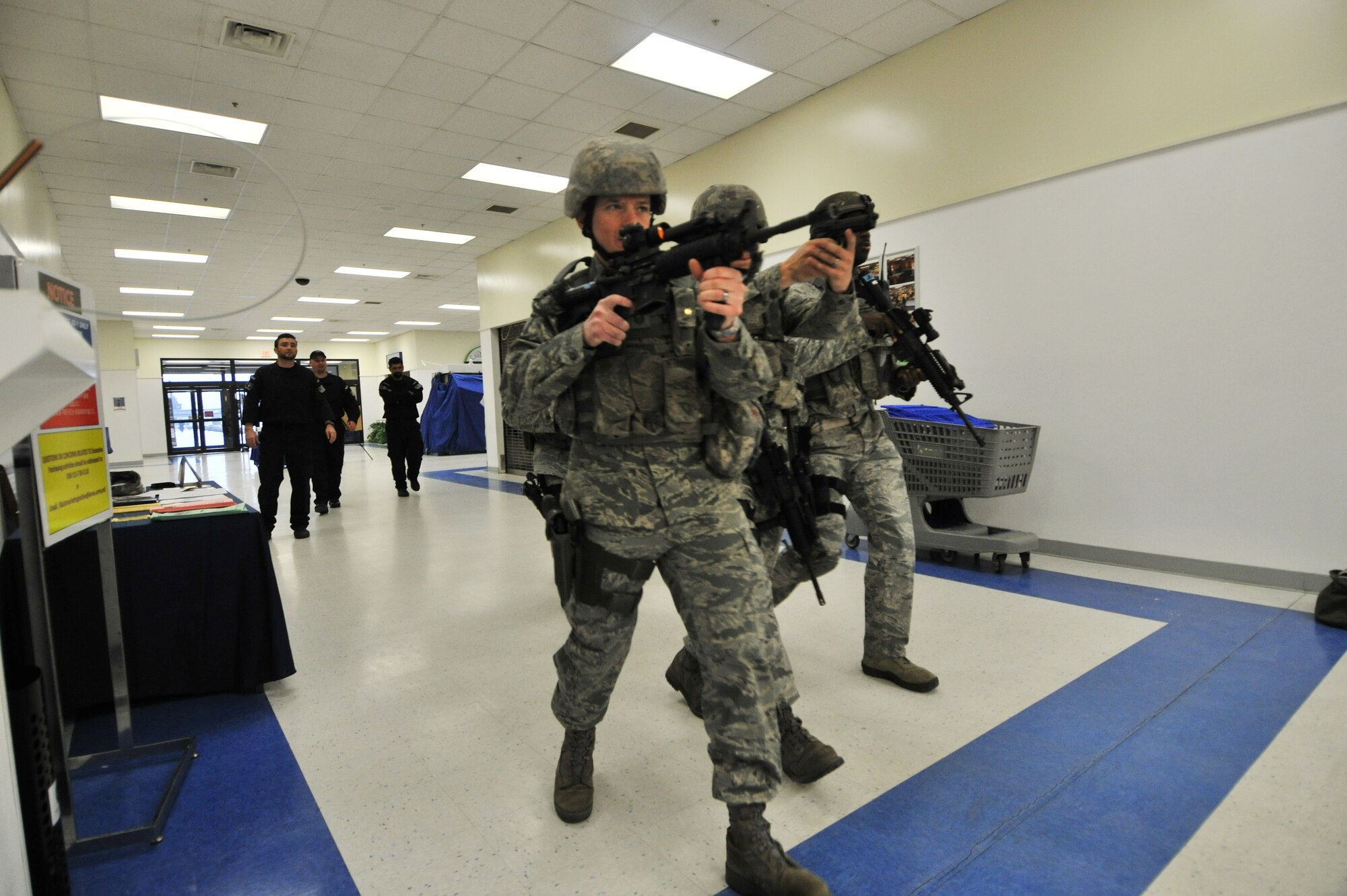 Members of the 8th Security Forces Squadron respond to an active shooter during a Pacific Air Forces High Risk Response Training at Kunsan Air Base, Republic of Korea, Jan. 13, 2012. The course provides effective response tactics to empower PACAF security forces members to swiftly eliminate active shooter and other high risk response threats. (U.S. Air Force photo by Senior Airman Brittany Y. Auld/Released)