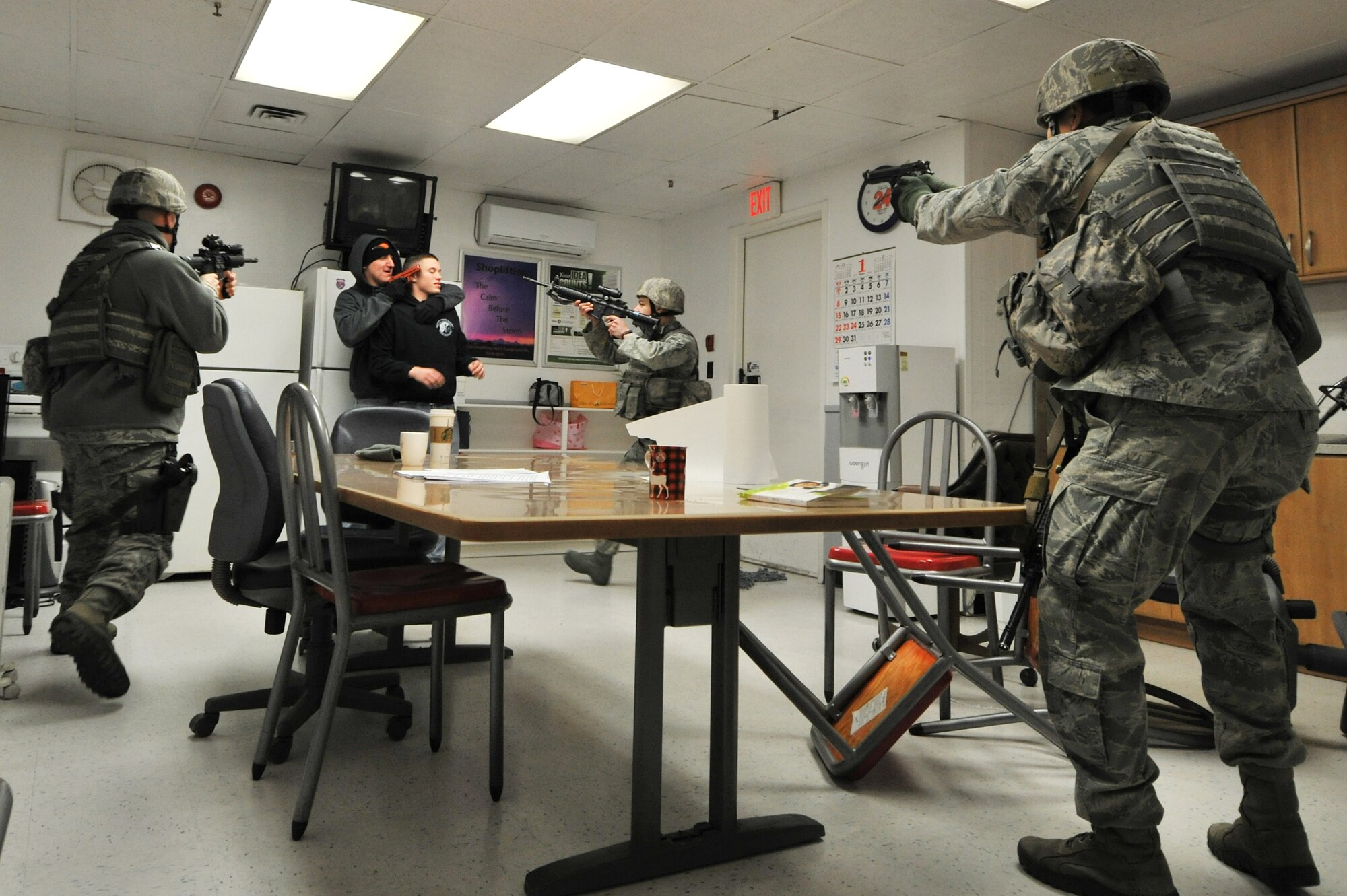 Members of the 8th Security Forces Squadron respond to an active shooter during a Pacific Air Forces High Risk Response Training at Kunsan Air Base, Republic of Korea, Jan. 13, 2012. The course provides effective response tactics to empower PACAF security forces members to swiftly eliminate active shooter and other high risk response threats. (U.S. Air Force photo by Senior Airman Brittany Y. Auld/Released)