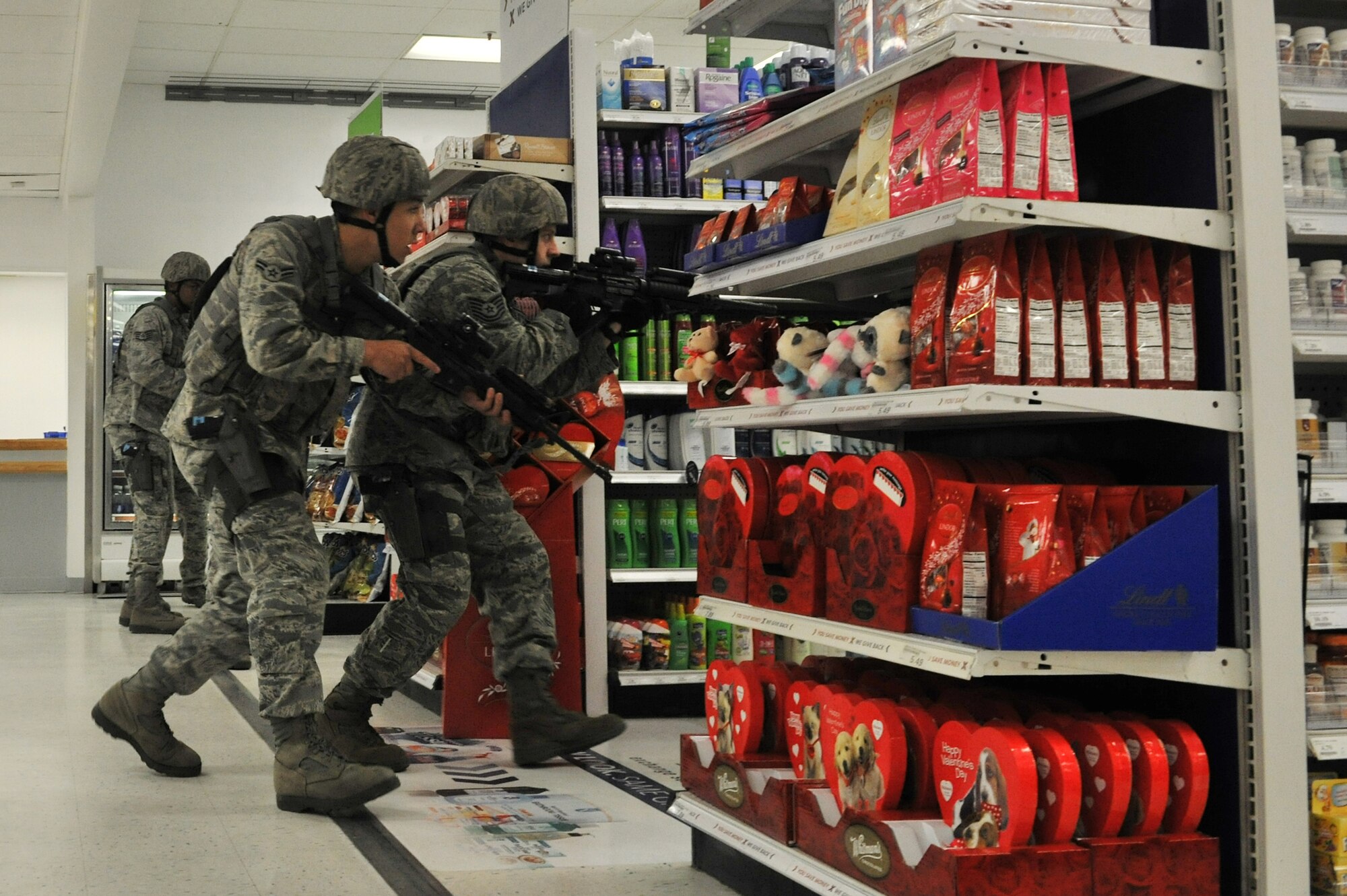 Members of the 8th Security Forces Squadron respond to an active shooter during a Pacific Air Forces High Risk Response Training at Kunsan Air Base, Republic of Korea, Jan. 13, 2012. The course provides effective response tactics to empower PACAF security forces members to swiftly eliminate active shooter and other high risk response threats. (U.S. Air Force photo by Senior Airman Brittany Y. Auld/Released)