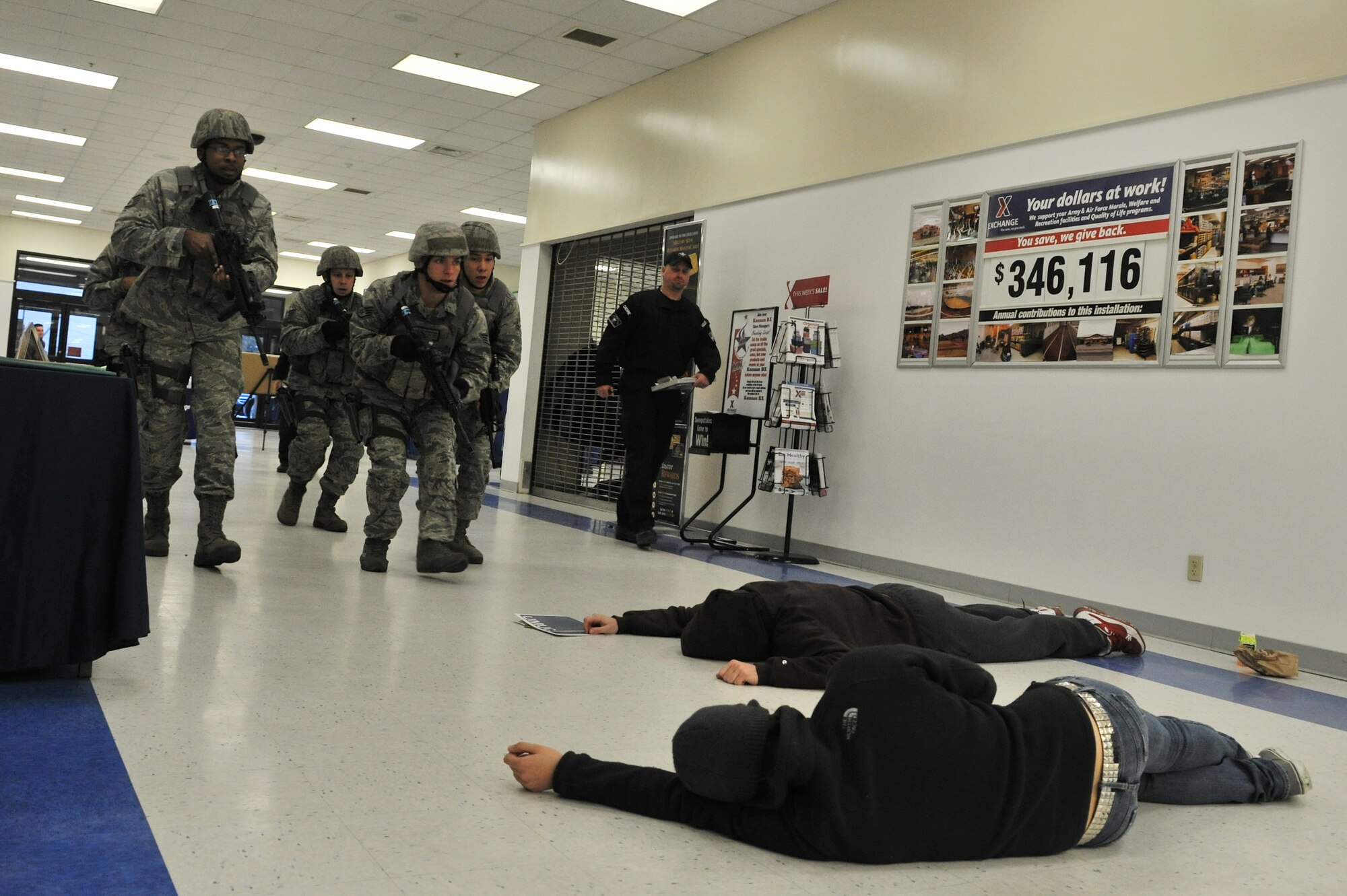 Members of the 8th Security Forces Squadron respond to an active shooter during a Pacific Air Forces High Risk Response Training at Kunsan Air Base, Republic of Korea, Jan. 13, 2012. The course provides effective response tactics to empower PACAF security forces members to swiftly eliminate active shooter and other high risk response threats. (U.S. Air Force photo by Senior Airman Brittany Y. Auld/Released)