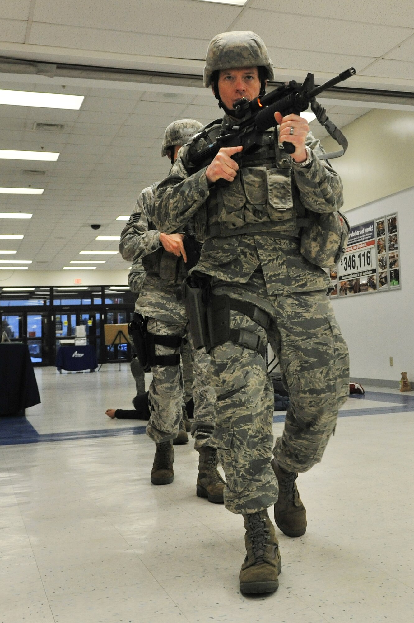 Members of the 8th Security Forces Squadron respond to an active shooter during a Pacific Air Forces High Risk Response Training at Kunsan Air Base, Republic of Korea, Jan. 13, 2012. The course provides effective response tactics to empower PACAF security forces members to swiftly eliminate active shooter and other high risk response threats. (U.S. Air Force photo by Senior Airman Brittany Y. Auld/Released)