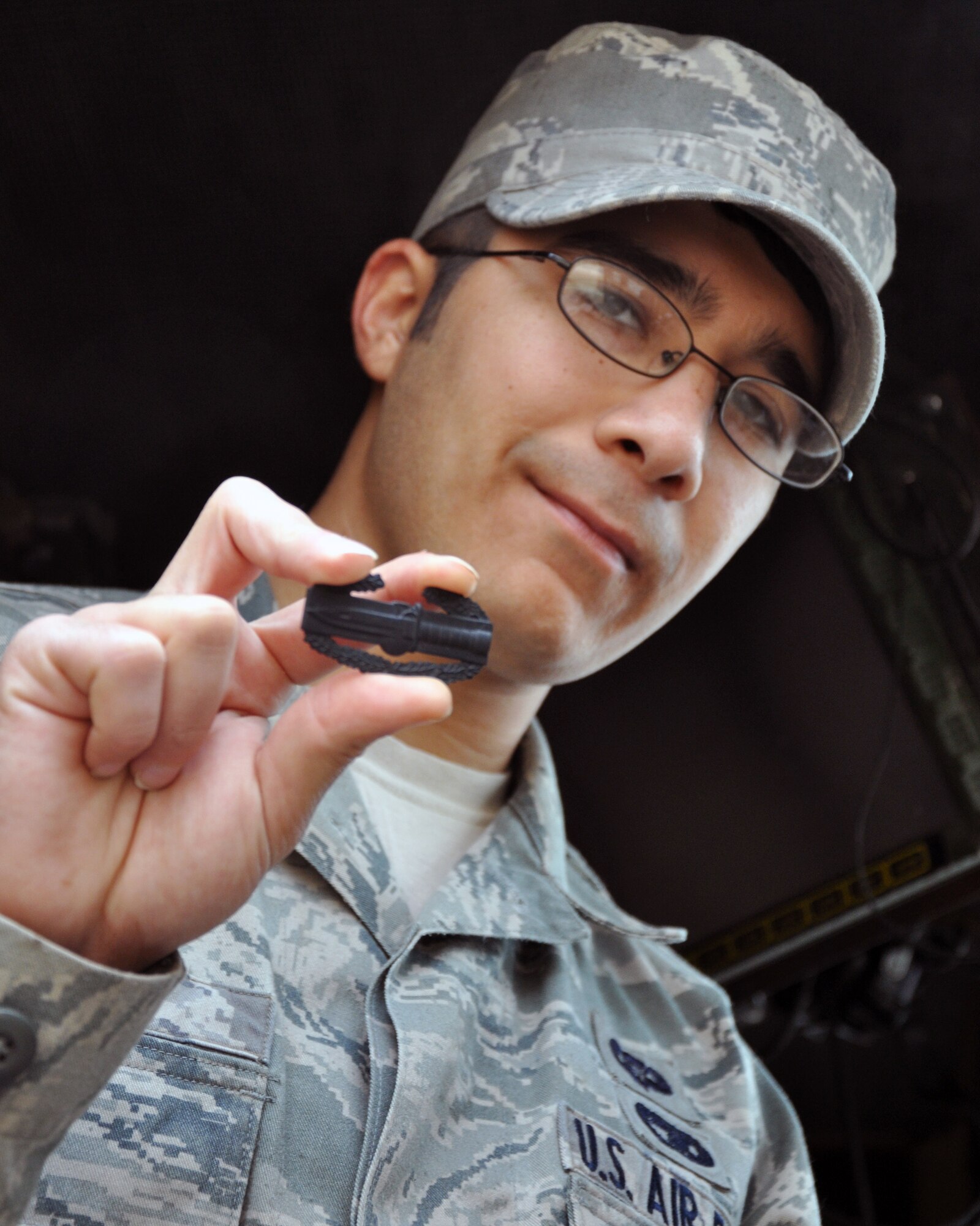 Airman 1st Class Daniel Clark, 387th Expeditionary Logistics Readiness Squadron, received a Combat Action Badge during operations in Iraq in 2011.  Clark was in a vehicle struck by an improvised explosive device outside Tikrit, Iraq.He credits his training for helping him keep cool and get out of the area safely. Clark is from the from the 100th Logistics Readiness Squadron, Royal Air Force Mildenhall, U.K. (U.S. Air Force photo/Tech. Sgt. Stacy Fowler)
