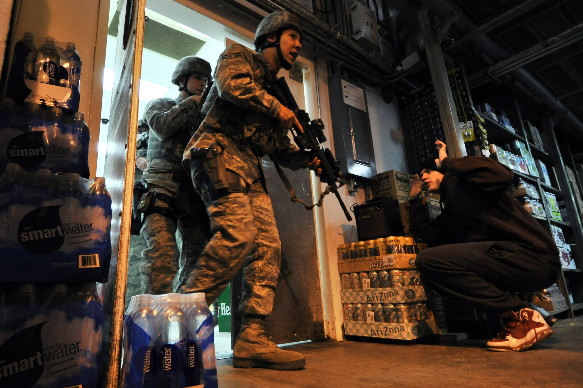 Members of the 8th Security Forces Squadron respond to an active shooter during a Pacific Air Forces High Risk Response Training at Kunsan Air Base, Republic of Korea, Jan. 13, 2012. A goal of the program is to aid law enforcement officers in their ability to safely and effectively respond to, address and stop an active shooter. (U.S. Air Force photo by Senior Airman Brittany Y. Auld/Released)