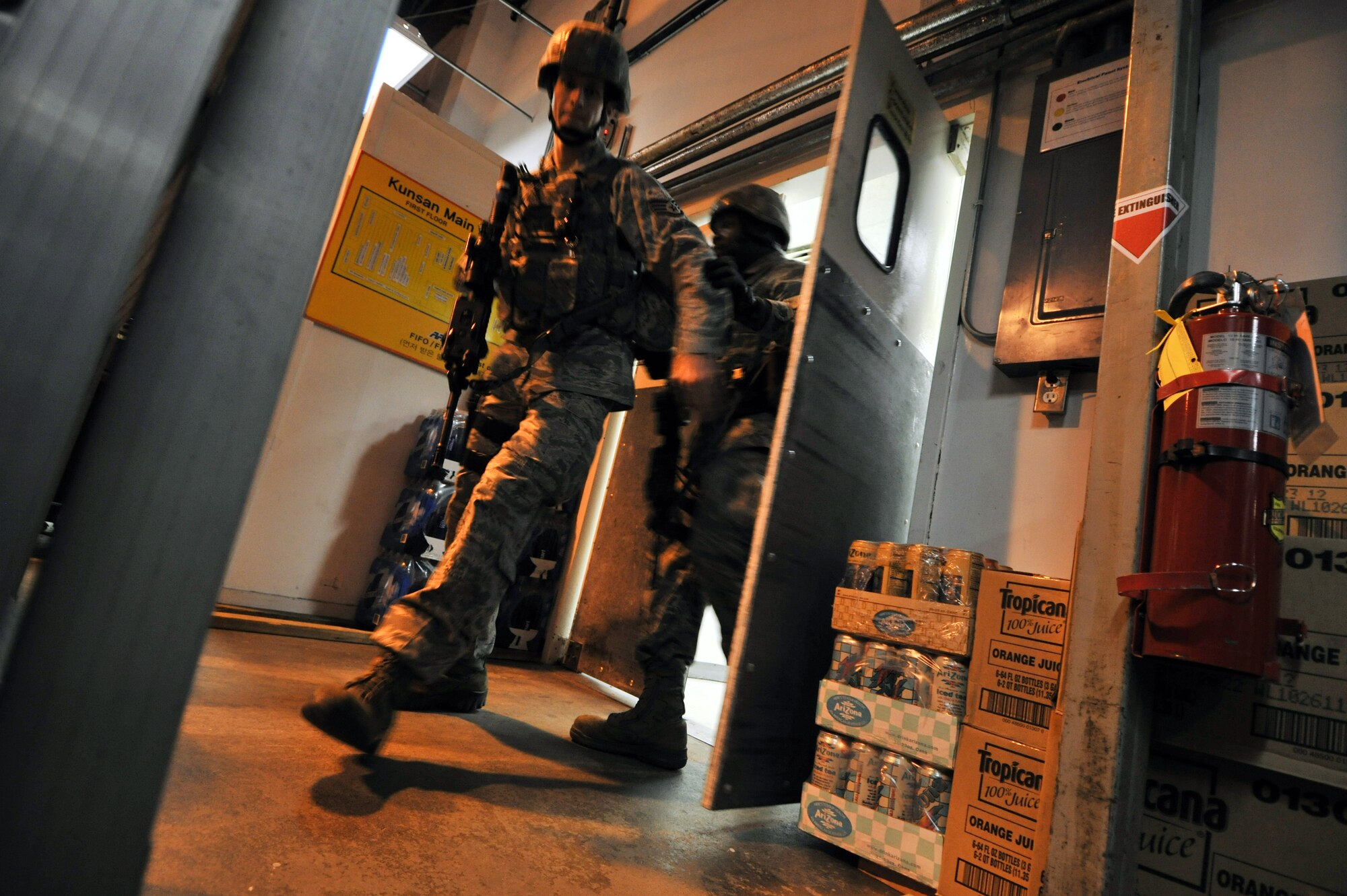 Members of the 8th Security Forces Squadron respond to an active shooter during a Pacific Air Forces High Risk Response Training at Kunsan Air Base, Republic of Korea, Jan. 13, 2012. A goal of the program is to aid law enforcement officers in their ability to safely and effectively respond to, address and stop an active shooter. (U.S. Air Force photo by Senior Airman Brittany Y. Auld/Released)