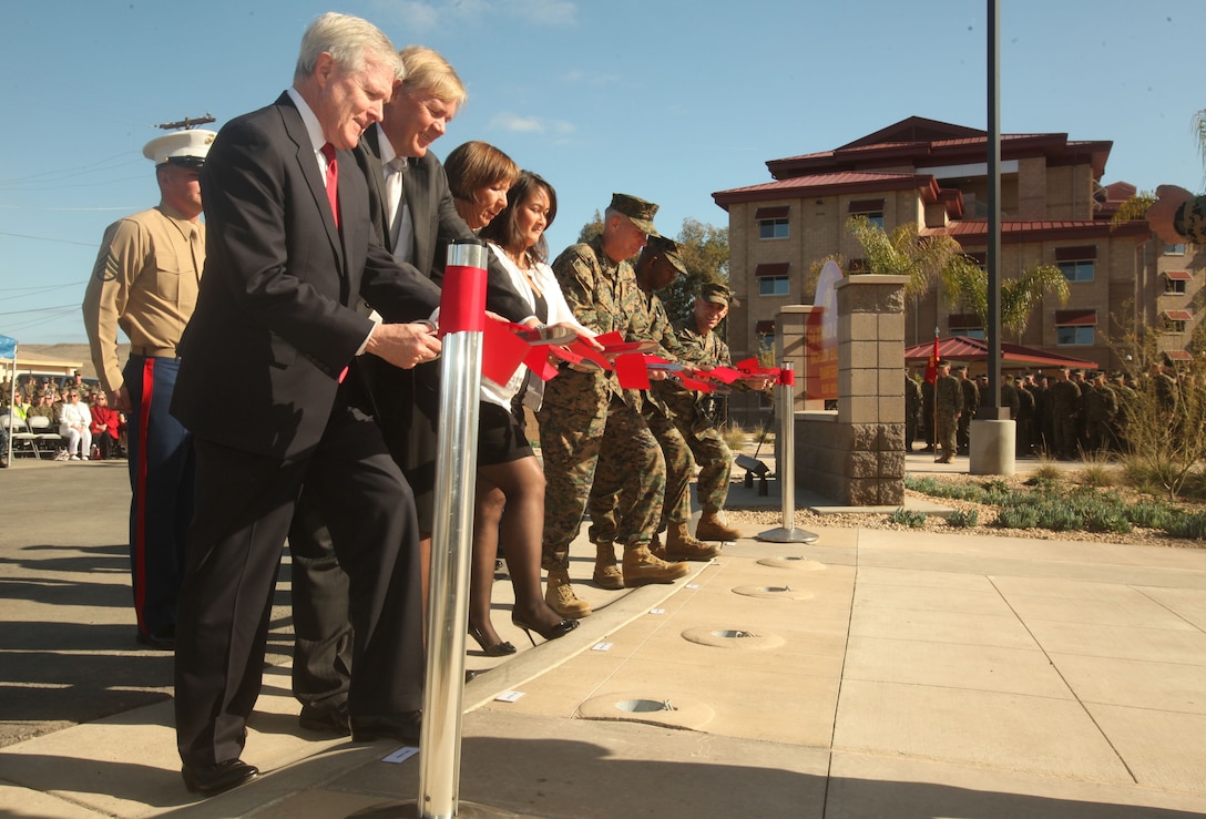 Secretary of the Navy Ray Mabus, the Hogan family and Marine VIPs cut the ribbon for the Lance Cpl. Donald J. Hogan Bachelor Enlisted Quarters here, Jan. 17. The $124 million barracks complex commemorates the sacrifices of fallen infantryman with 1st Battalion, 5th Marine Regiment. Hogan, a native of San Clemente died to save his fellow Marines in Helmand province, Afghanistan, Aug. 26, 2009. (Official U.S. Marine Corps photo by Sgt. Jesse Stence)