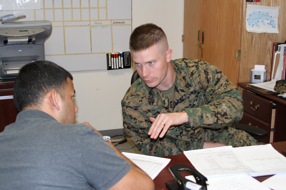 Staff Sgt. Jason D. Bryant, (right) prior service recruiter, Sector 1, Prior Service Recruiting Station 8, discusses available benefits and services to Cpl. Jose Pena, during the process to re-join Pena to a local reserve unit.   Bryant, along with four other prior service Marine recruiters, were instrumental to the success of their station and the subsequent Staff Noncommissioned Officer-in-Charge of the Year award received by their boss, Gunnery Sgt. Mario N. Atkins.