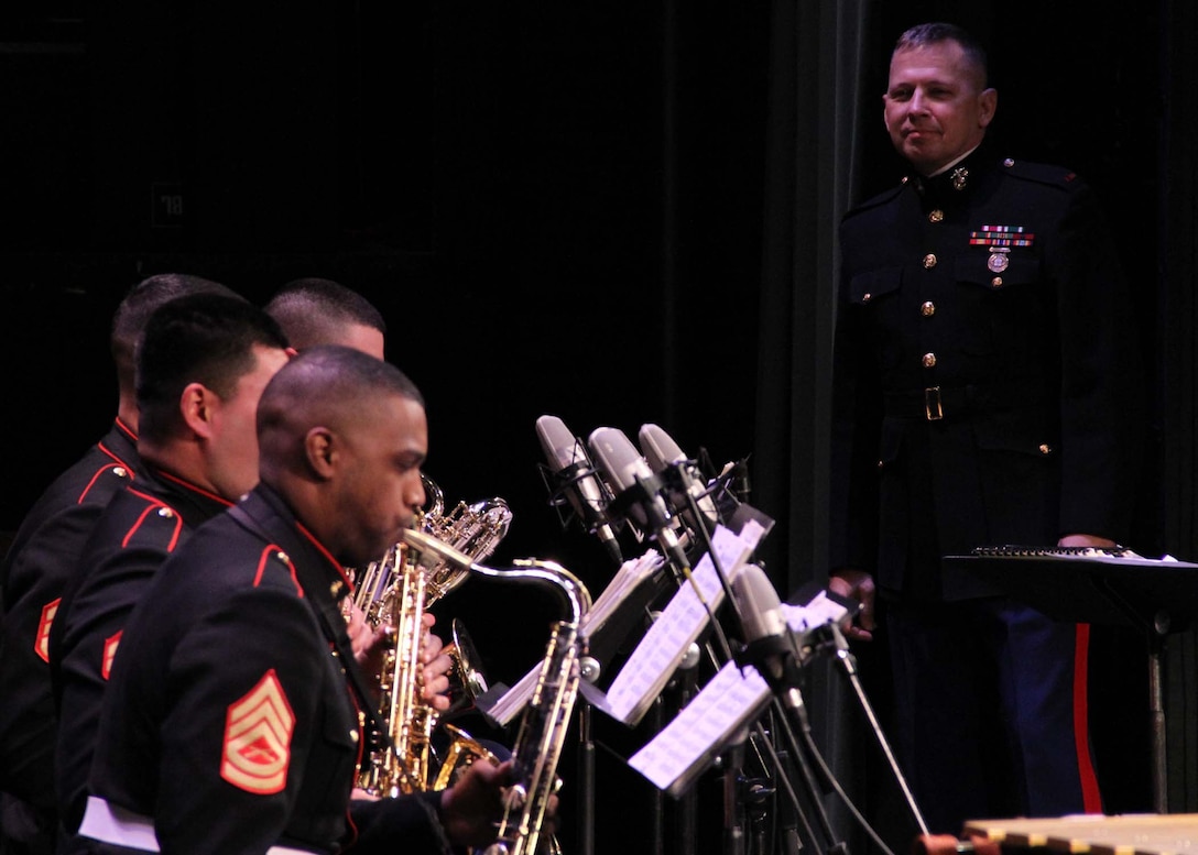 Chief Warrent Officer 4 Jim Ford, ocuppational field sponser, Marine Corps Music Program, looks on at the Marine Corps All-Star Jazz band as they perform at the Long Center for the Performing Arts, Lafayette, Ind., Jan. 19. The band participated in the Purdue Jazz Festival during their tour of the Midwest.