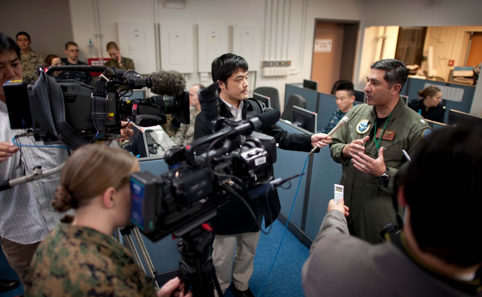 YOKOTA AIR BASE, Japan -- Cmdr. Tim Curry, U.S. Forces, Japan, deputy director of operations, talks about the upcoming exercise with local reporters at the Bilateral Joint Operations Coordination Center, Yokota Air Base, Japan, Jan. 19, 2012. The exercise is the latest in a series of joint/bilateral command post exercises involving U.S. military and Japan Self-Defense Forces personnel designed to increase combat readiness and interoperability of U.S. and Japanese forces. (U.S. Air Force photo/Staff Sgt. Samuel Morse)