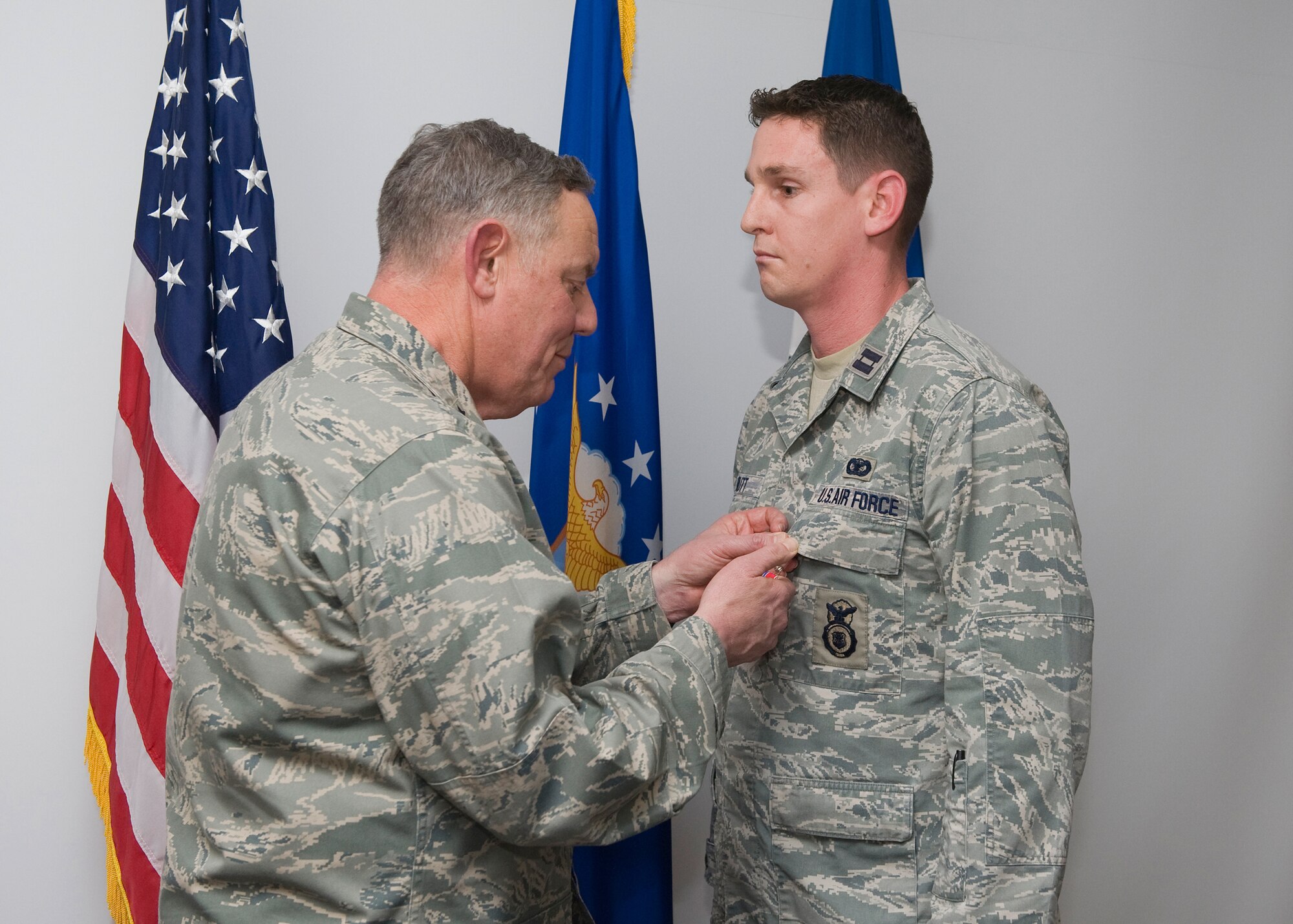 Alston pins on a Bronze Star Medal on Capt. Brian Rutt, 341st Security Support Squadronoperations officer, Jan. 13. (U.S. Air Force photo/Beau Wade)