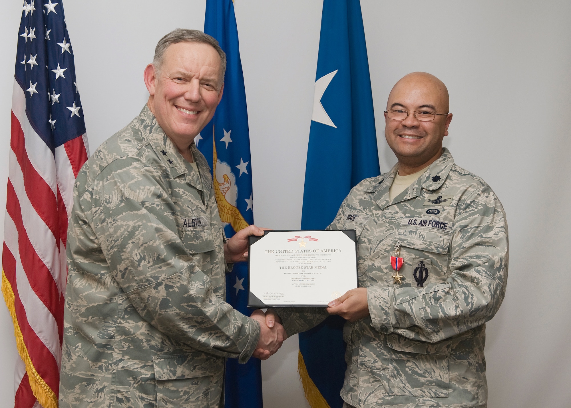 Maj. Gen. C. Donald Alston, 20th Air Force commander, awarded Lt. Col. William Wade Jr., 341st Mission Support Group vice commander, a Bronze Star Medal certificate during a Bronze Star Medal ceremony held at the wing conference room Jan. 13. (U.S. Air Force photo/Beau Wade)