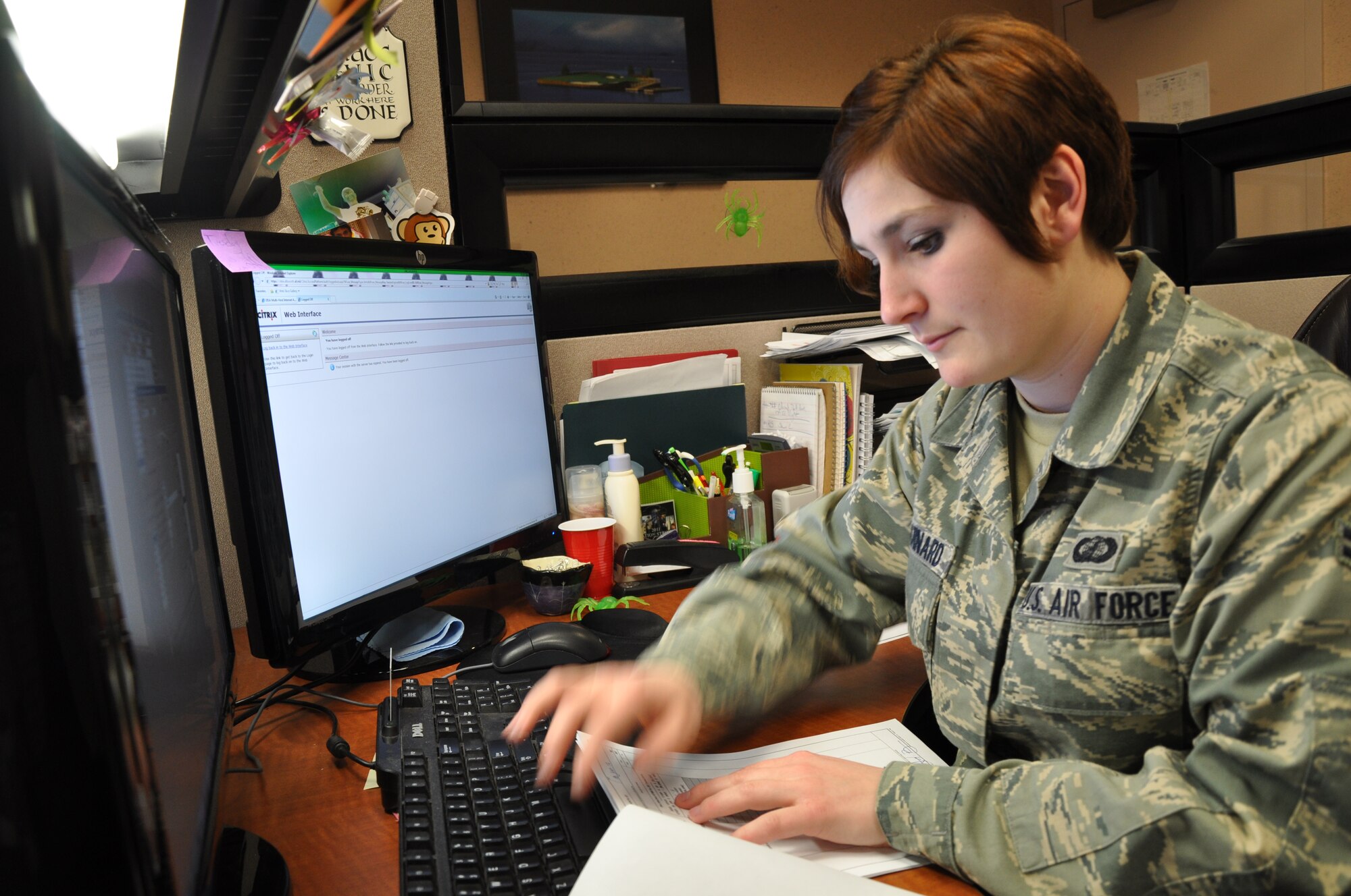Airman 1st Class Monika L. Chouinard, 9th Comptroller Squadron customer service technician, works on a Permanent Change of Station order at Beale Air Force Base Calif., Jan. 18, 2012. Recently Beale’s finance office implemented new service hours to accommodate shift workers. (U.S. Air Force photo by Staff Sgt. Robert M. Trujillo/Released)