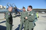 Col. Tom Murphy, 47th Flying Training Wing commander, speaks with Col. Andrew Croft, 12th Operations Group commander, and Lt. Col. David Drichta, 435th Fighter Training Squadron commander, after delivering the final T-38C Talon to the 435th FTS at Randolph, Jan. 18, 2012.  The jet is the last of 20 jets to be transferred from the 434th Fighter Training Squadron at Laughlin AFB, Texas to the 435th FTS as part of the consolidation of the Introduction to Figher Fundamentals training course. Due to the consolidation, the 435th FTS will also gain 11 active duty instructor pilots, more than 30 support positions, and 80 additional students annually. (U.S. Air Force photo by Rich McFadden
