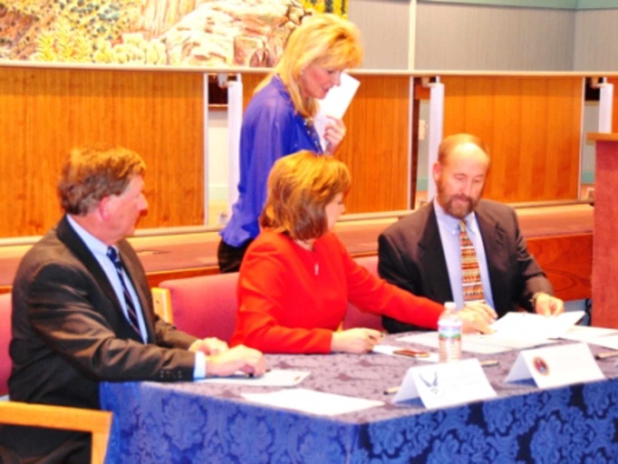 (Left to Right) Assistant Secretary of the Air Force Terry Yonkers, Gov. Susana Martinez and Commissioner Ray Powell sign the official lease documentation during a ceremony Jan 18 in Santa Fe, N.M.  The additional 11,000 acres of land will allow Cannon Air Force Base to expand Joint Air Force Special Operations training areas.   