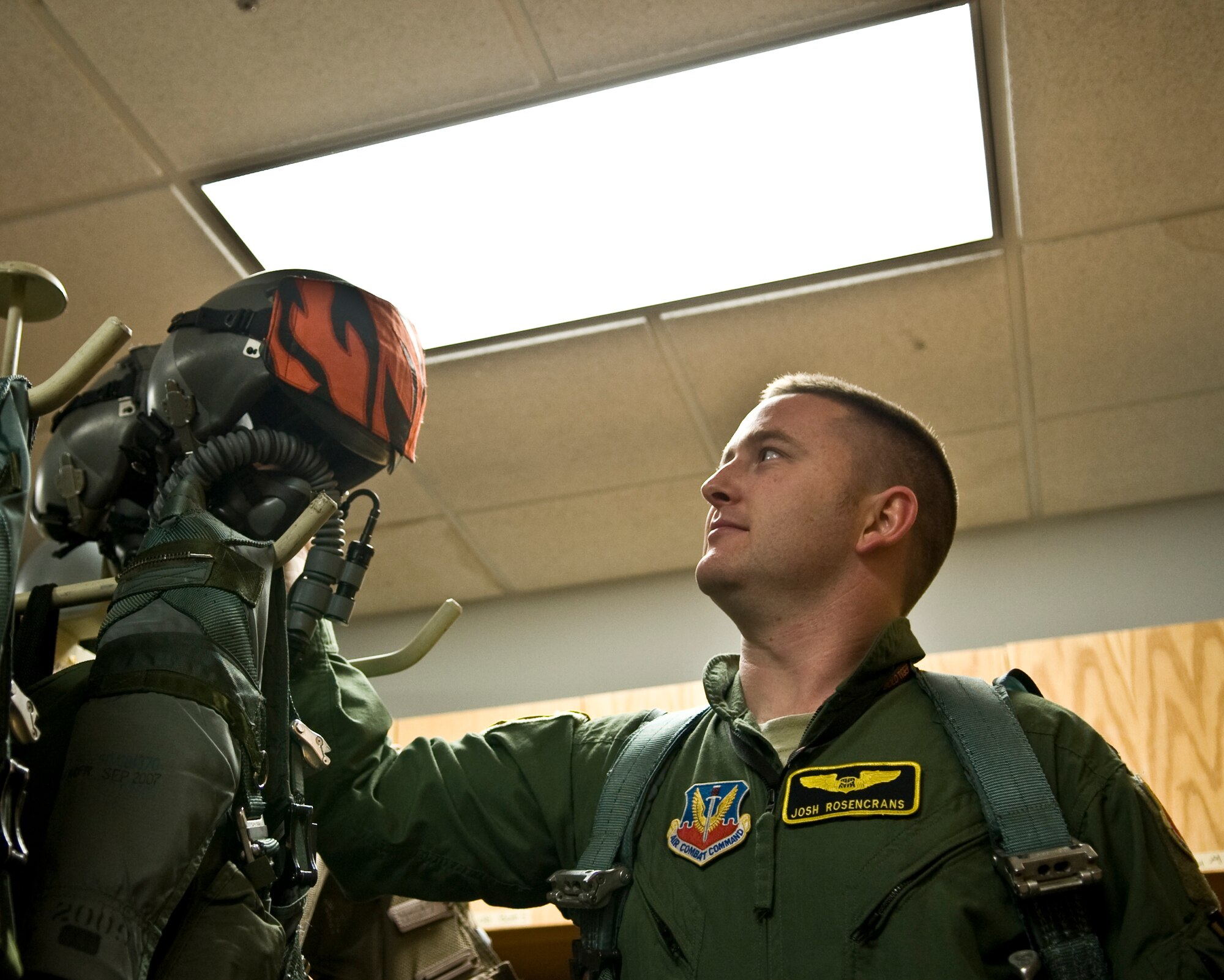 1st Lt. Josh Rosencrans, 391st Fighter Squadron from Mountain Home Air Force Base, Idaho, grabs a flight helmet on Barksdale Air Force Base, La., Jan. 18. Two hundred twenty five personnel from Mountain Home AFB traveled to Barksdale to participate in Green Flag. The exercise provides fighter squadrons practice in combat scenarios helping them prepare for deployments where close air support is needed. (U.S. Air Force photo/Airman 1st Class Benjamin Gonsier)(RELEASED)
