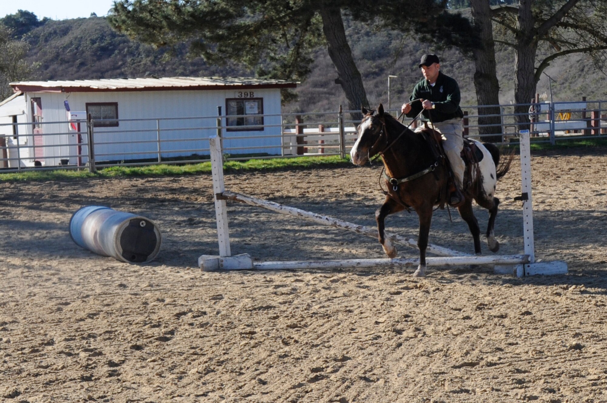 VANDENBERG AIR FORCE BASE, Calif. – Tech. Sgt. Sean Yargus, a 30th Security Forces Squadron conservation officer, trains and exercises with Six Eagle in the arena When not on patrol, the horses perform exercises and training consisting of arena work and lunging. Yargus is the NCO in charge of the only Mounted Horse Patrol unit in the entire Air Force.  (U.S. Air Force photo/Tech. Sgt. Scottie T. McCord)