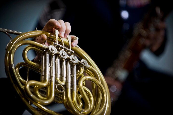 U.S. Air Force Staff Sgt. Eddie Ochsner, Golden West Winds Woodwind Quintet french horn player, performs Jan. 19, 2012, at Lomie Heard Elementary School on Nellis Air Force Base, Nev. The U.S. Air Force Band of the Golden West, stationed at Travis Air Force Base, Calif., held a number of free, public concerts at numerous locations during a visit to Southern Nevada. (U.S. Air Force photo by Senior Airman Brett Clashman)
