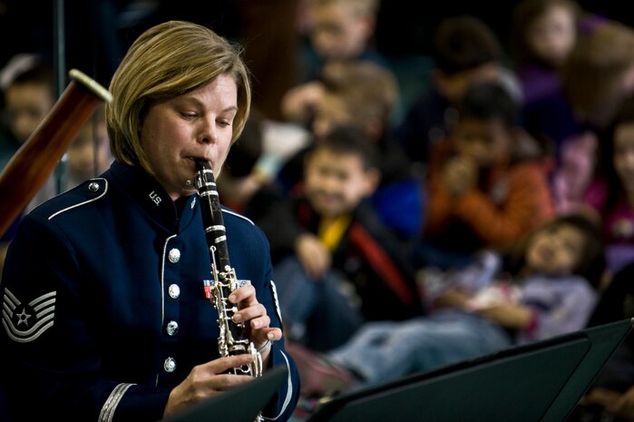 U.S. Air Force Tech. Sgt. Anna Andrew, Golden West Winds Woodwind Quintet clarinet player, performs Jan. 19, 2012, at Lomie Heard Elementary School on Nellis Air Force Base, Nev. The U.S. Air Force Band of the Golden West, stationed at Travis Air Force Base, Calif., held a number of free, public concerts at numerous locations during a visit to Southern Nevada. (U.S. Air Force photo by Senior Airman Brett Clashman)
