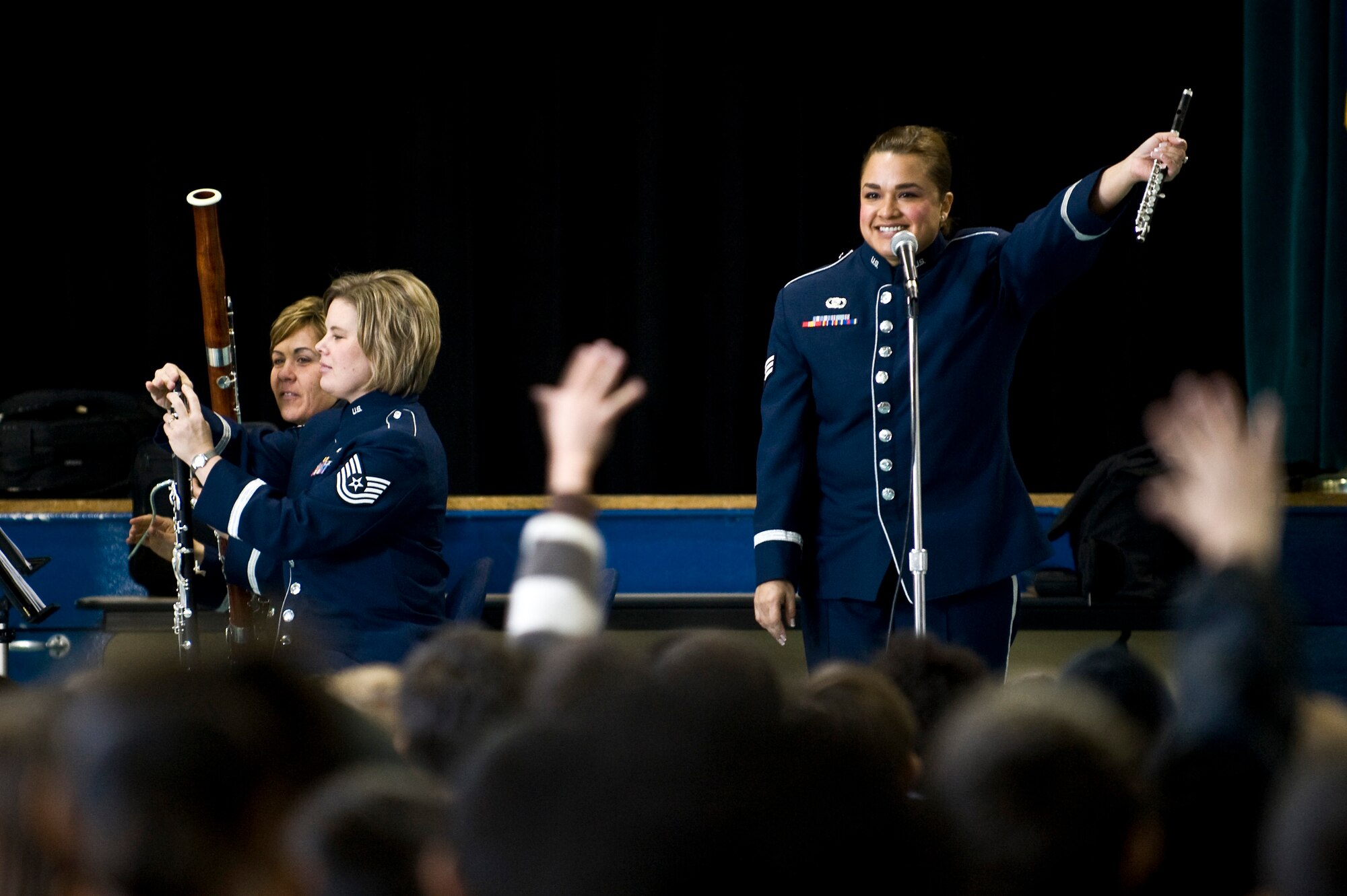U.S. Air Force Senior Airman Melissa Rocha, Golden West Winds Woodwind Quintet piccolo player, asks Lomie Heard Elementary School students what instrument she is holding Jan. 19, 2012, at Nellis Air Force Base, Nev. The U.S. Air Force Band of the Golden West, stationed at Travis Air Force Base, Calif., held a number of free, public concerts at numerous locations during a visit to Southern Nevada. (U.S. Air Force photo by Senior Airman Brett Clashman)
