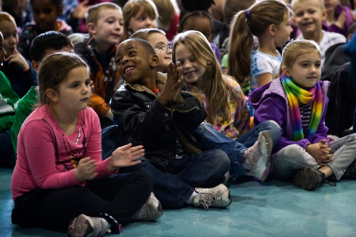 Students of Lomie Heard Elementary School applaud after the Golden West Winds Woodwind Quintet performs a song Jan. 19, 2012, at Nellis Air Force Base, Nev. The U.S. Air Force Band of the Golden West, stationed at Travis Air Force Base, Calif., held a number of free, public concerts at numerous locations during a visit to Southern Nevada. (U.S. Air Force photo by Senior Airman Brett Clashman)
