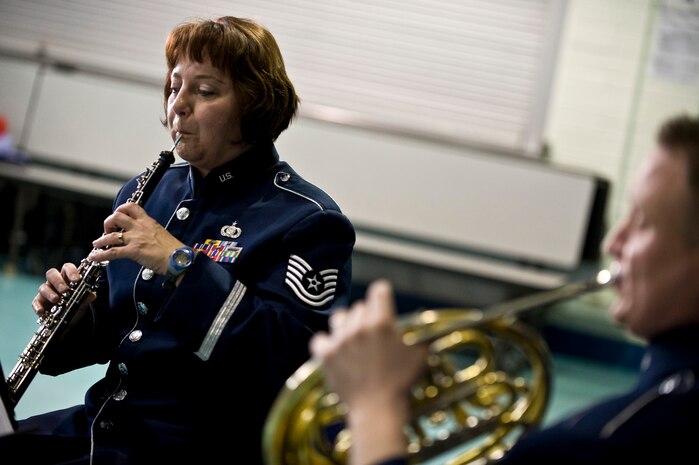 U.S. Air Force Tech. Sgt. Coreen Levin, Golden West Winds Woodwind Quintet clarinet player, performs Jan. 19, 2012, at Lomie Heard Elementary School on Nellis Air Force Base, Nev. The U.S. Air Force Band of the Golden West, stationed at Travis Air Force Base, Calif., held a number of free, public concerts at numerous locations during a visit to Southern Nevada. (U.S. Air Force photo by Senior Airman Brett Clashman)
