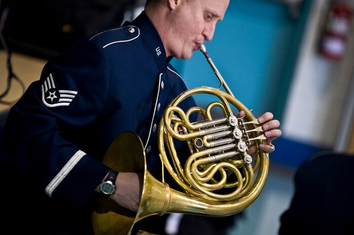 U.S. Air Force Staff Sgt. Eddie Ochsner, Golden West Winds Woodwind Quintet french horn player, performs Jan. 19, 2012, at Lomie Heard Elementary School on Nellis Air Force Base, Nev.  The U.S. Air Force Band of the Golden West, stationed at Travis Air Force Base, Calif., held a number of free, public concerts at numerous locations during a visit to Southern Nevada. (U.S. Air Force photo by Senior Airman Brett Clashman)
