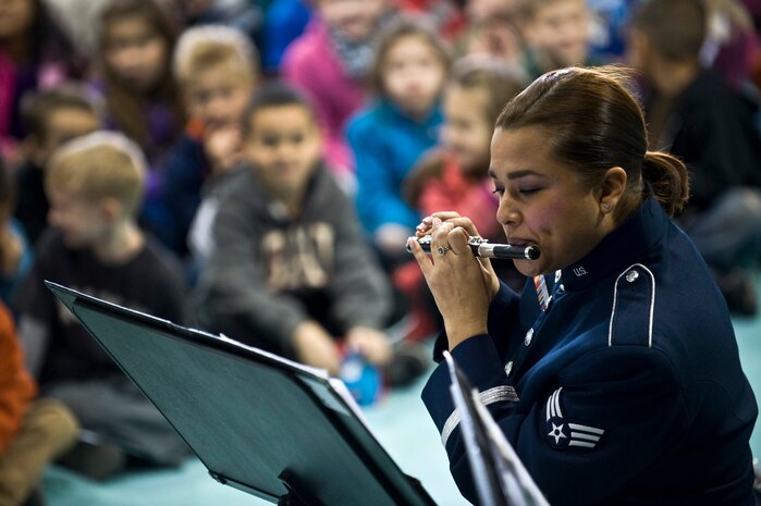 U.S. Air Force Senior Airman Melissa Rocha, Golden West Winds Woodwind Quintet piccolo player, performs Jan. 19, 2012, at Lomie Heard Elementary School on Nellis Air Force Base, Nev. The U.S. Air Force Band of the Golden West, stationed at Travis Air Force Base, Calif., held a number of free, public concerts at numerous locations during a visit to Southern Nevada. (U.S. Air Force photo by Senior Airman Brett Clashman)
