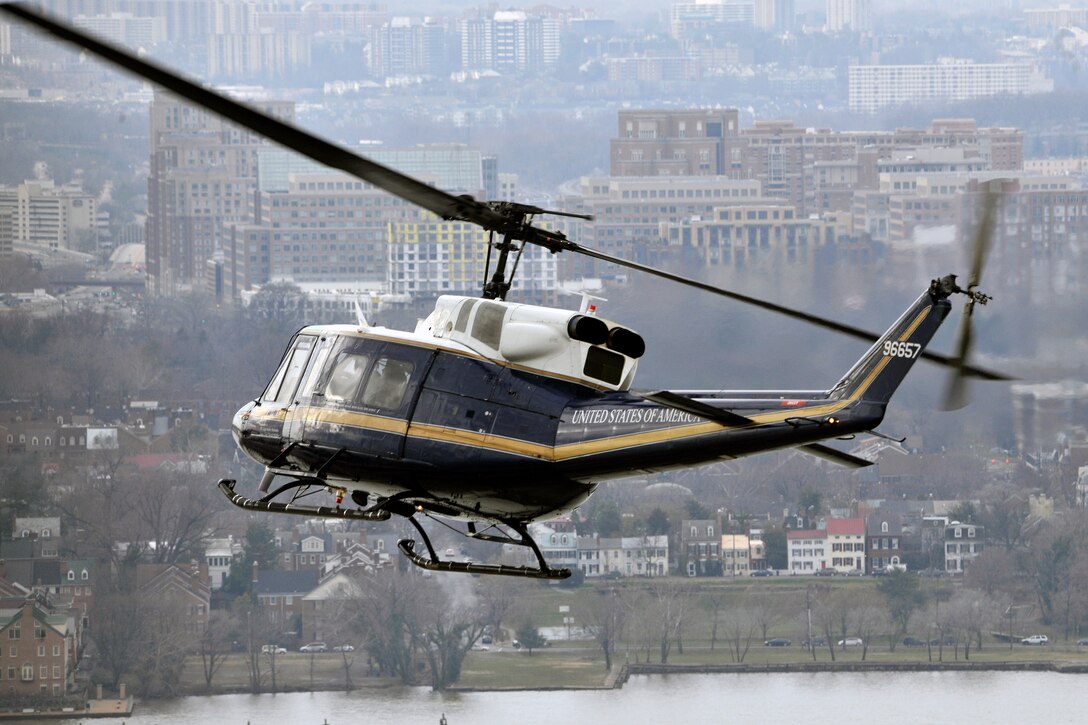 A 1st Helicopter Squadron UH-1N Iroquois helicopter turns toward the Potomac River, during a training mission Jan 17 near Oxon Hill, Md. The UH-1N is a light-lift utility helicopter used to support varied Air Force missions. Its primary functions include the airlift of emergency security and disaster response forces, the emergency evacuation of key government officials and the airlift of distinguished visitors and missile support personnel. (U.S. Air Force Photo/Senior Airman Perry Aston)