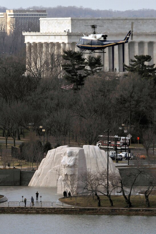 A 1st Helicopter Squadron UH-1N Iroquois helicopter flies past the Martin Luther King, Jr. Memorial during a training mission Jan 17 in Washington, D.C. The memorial, covering four acres, opened to the public on August 22, 2011, after more than two decades of planning, fund-raising and construction. (U.S. Air Force Photo/Senior Airman Perry Aston)