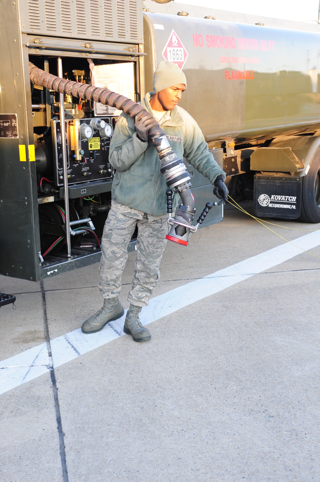 Airman 1st Class Jalen Sharp pulls the main servicing hose on an R-11 refueler on Seymour Johnson Air Force Base, N.C., Jan. 19, 2012. The main servicing hose transports JP-8 from the refueler to the aircraft. 4th Logistics Readiness Squadron fuels management Airmen are responsible for providing fuel to more than 500 vehicles and refueling more than 60 aircraft. Sharp, 4th LRS fuels distribution operator, is a native of Fayetteville, N.C. (U.S. Air Force photo/ Airman 1st Class Mariah Tolbert)