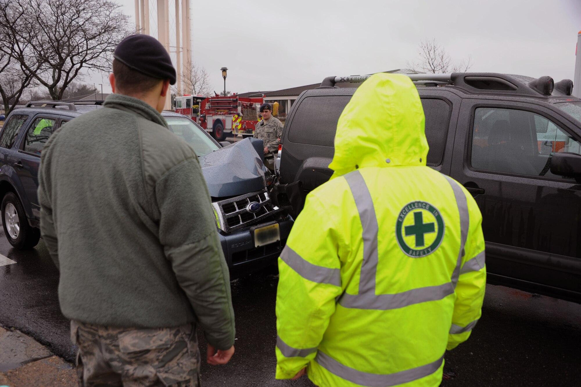 William Goldsberry, (right) Joint Base McGuire-Dix-Lakehurst Safety Office ground safety specialist from Ripley, Ohio, and Staff Sgt. Jimmie Harper, JB MDL Security Forces Squadron command support section from Cleveland, Ohio, assess a wreck which occurred here Jan. 17. Driving too close to another vehicle, driving too fast for road conditions and driver distractions are probable causes for rear-end collisions. (U.S. Air Force photo illustration by Airman 1st Class Dennis Sloan/Released)