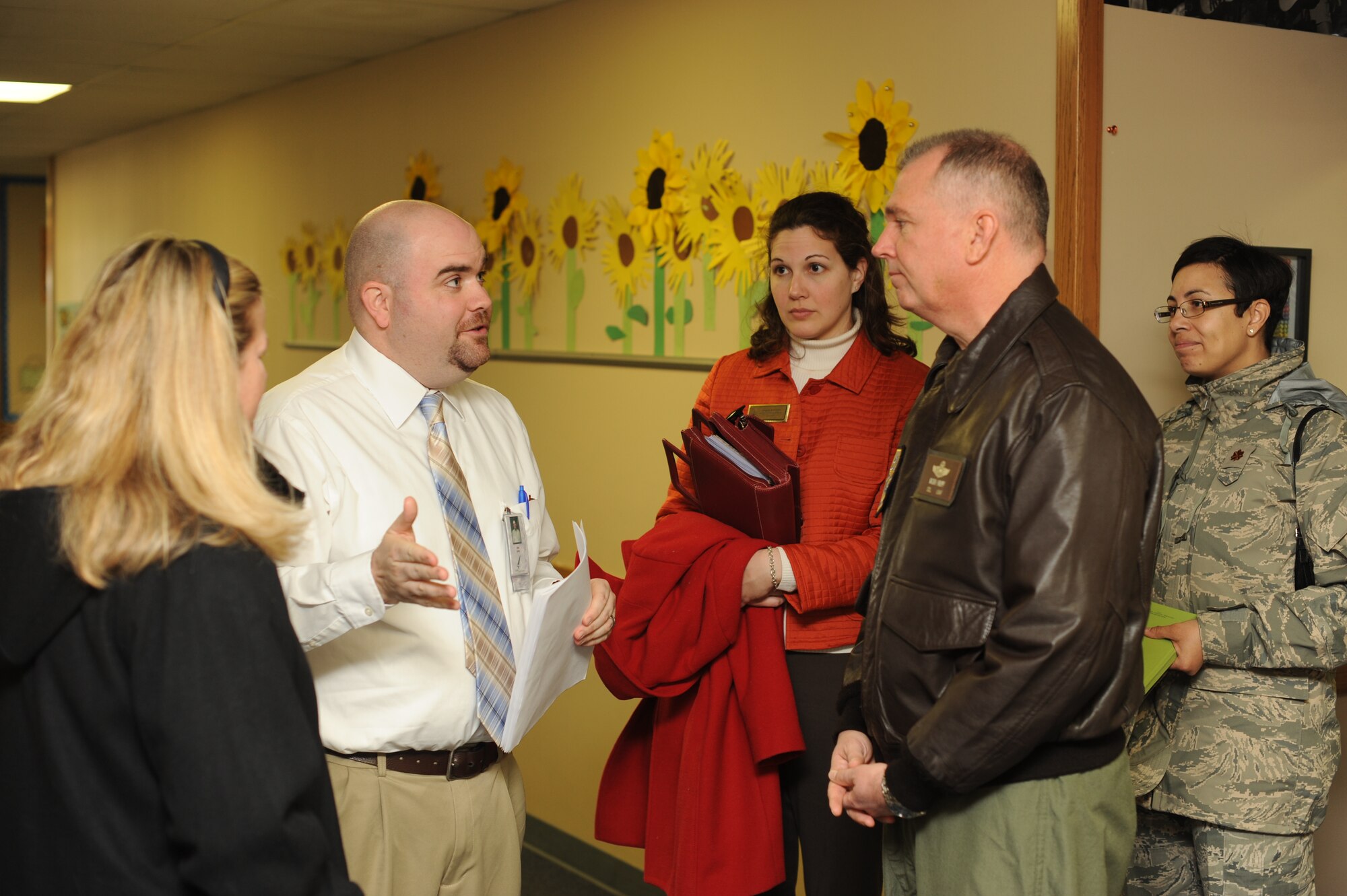 Clint Corby, Wineteer Elementary School principal, speaks with Col. Ricky Rupp, 22nd Air Refueling Wing commander, about the benefit of having McConnell’s volunteers during a tour of his school Jan. 17, 2012, Wineteer Elementary School, Wichita, Kan.  Corby and Rupp discussed the impact of having positive role models volunteering out of McConnell Air Force Base has on Wineteer Elementary School and how the school educates and accommodates military children.  (U.S. Air Force photo/Airman 1st Class Jose L. Leon)